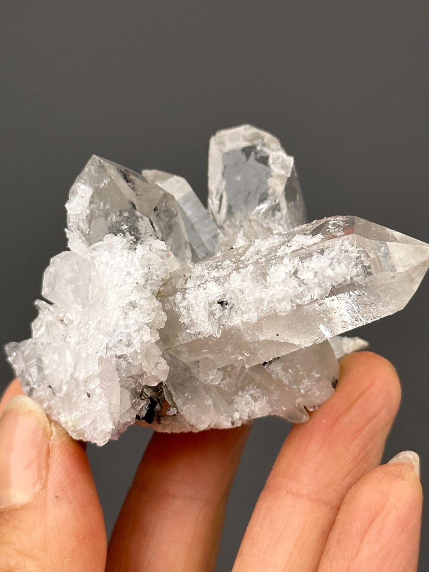 Side view of quartz cluster showing cassiterite inclusions