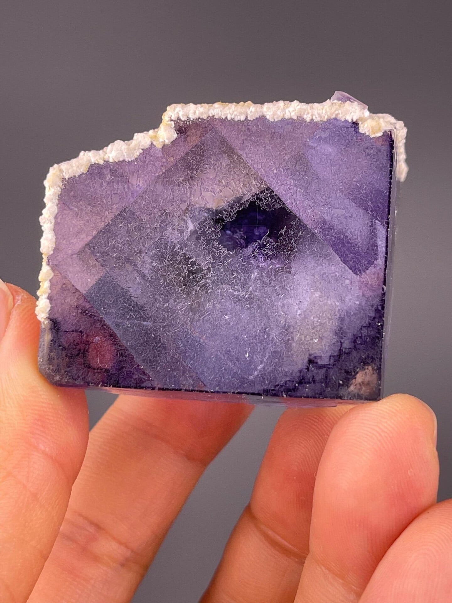 Phantom fluorite with calcite showing vitreous luster