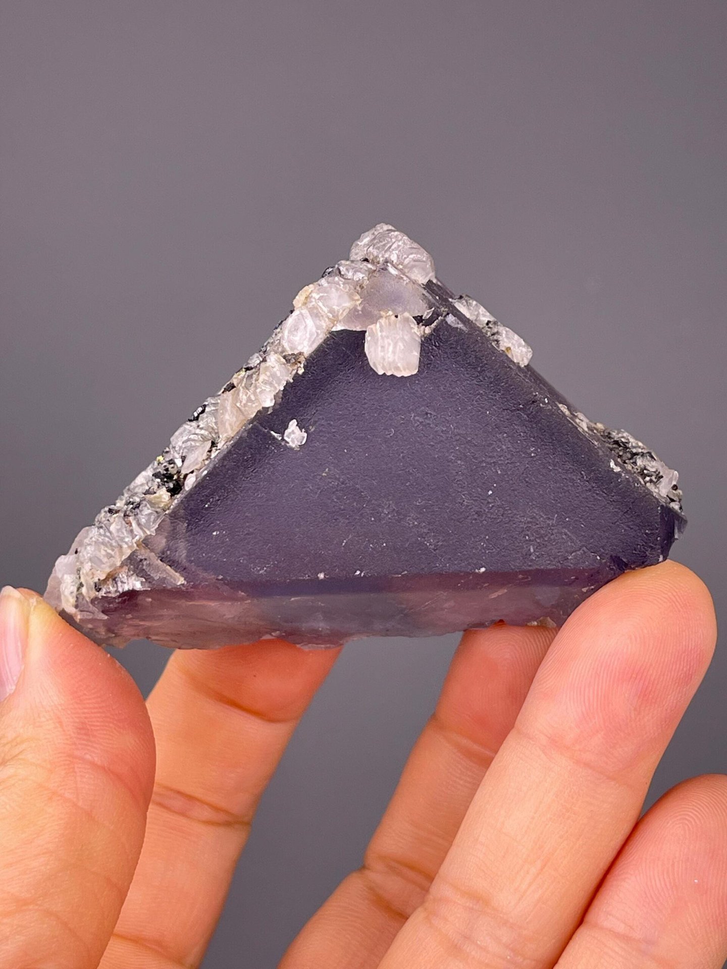 Close-up of triangular fluorite crystal face from China