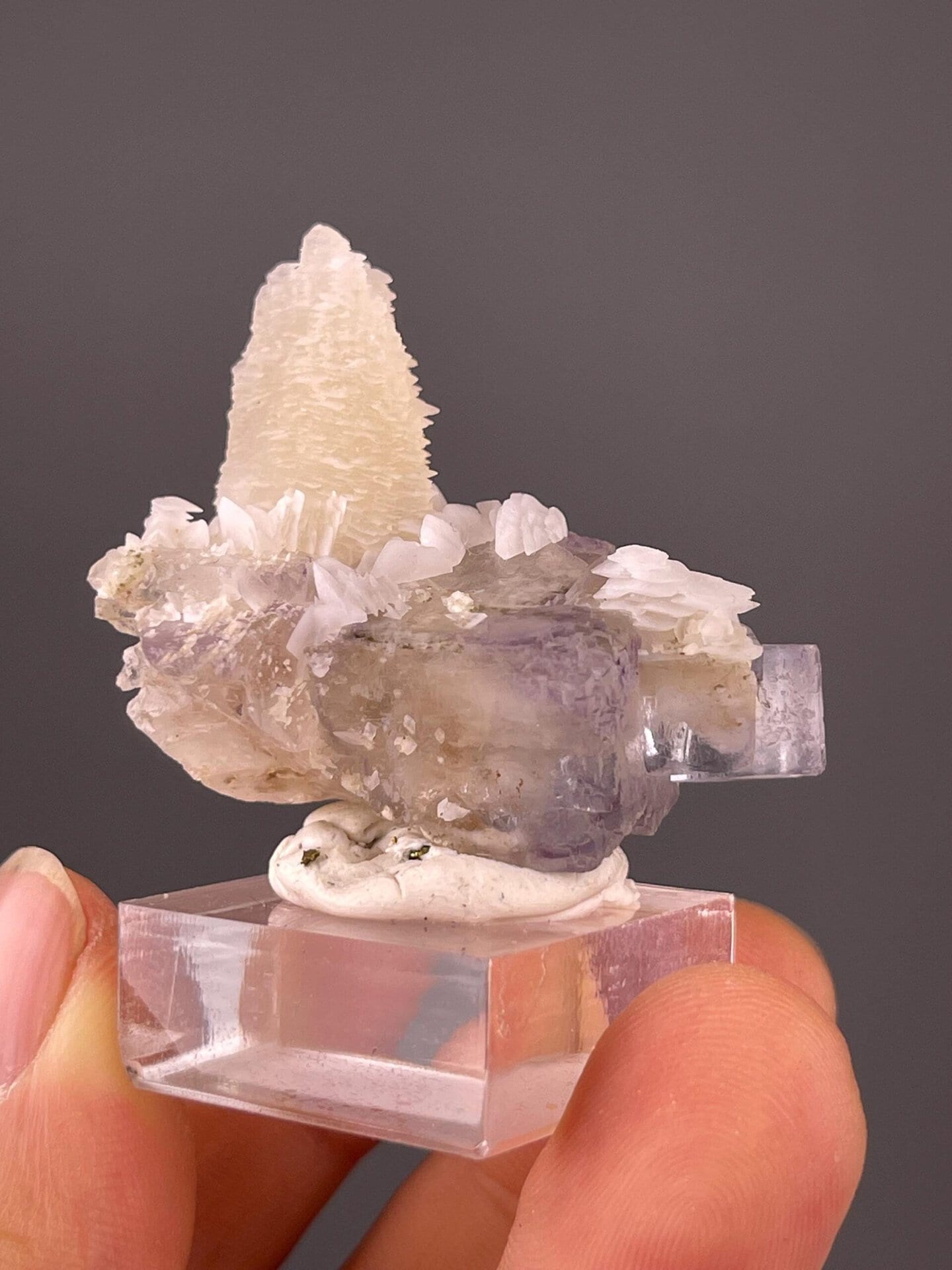 Side view of fluorite pagoda calcite combination specimen