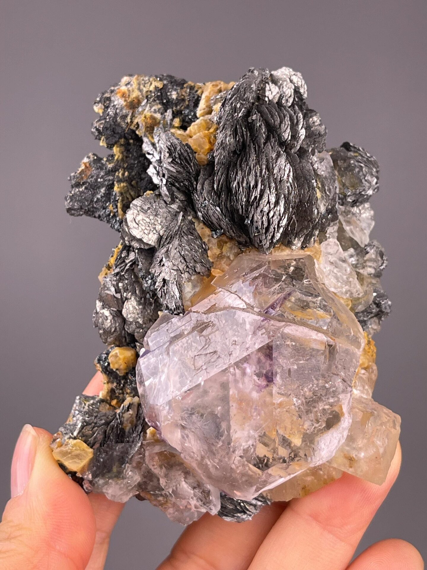 Fluorite with purple phantoms and marcasite blades from Inner Mongolia