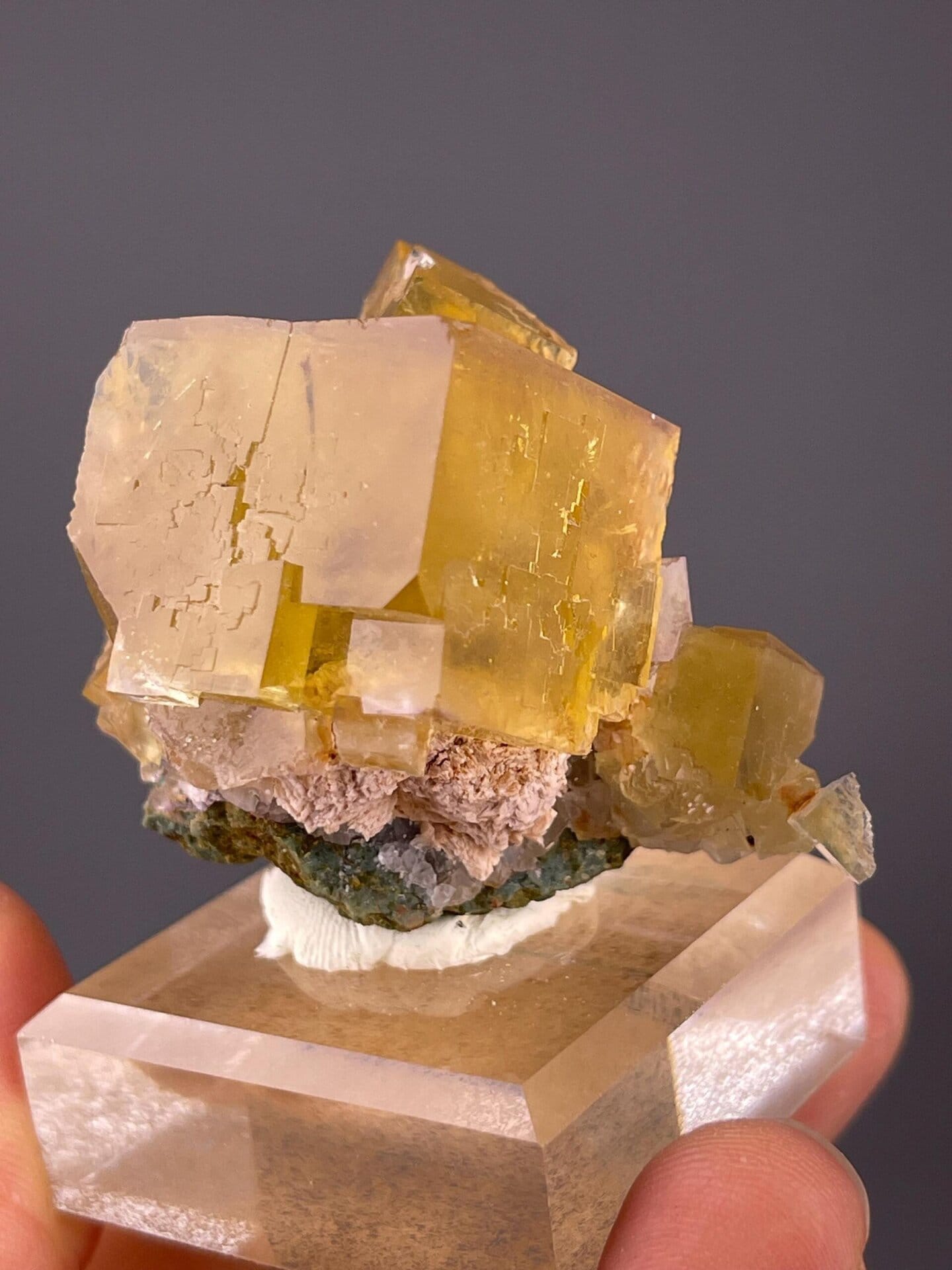 Yellow fluorite CaF2 isometric crystals on matrix