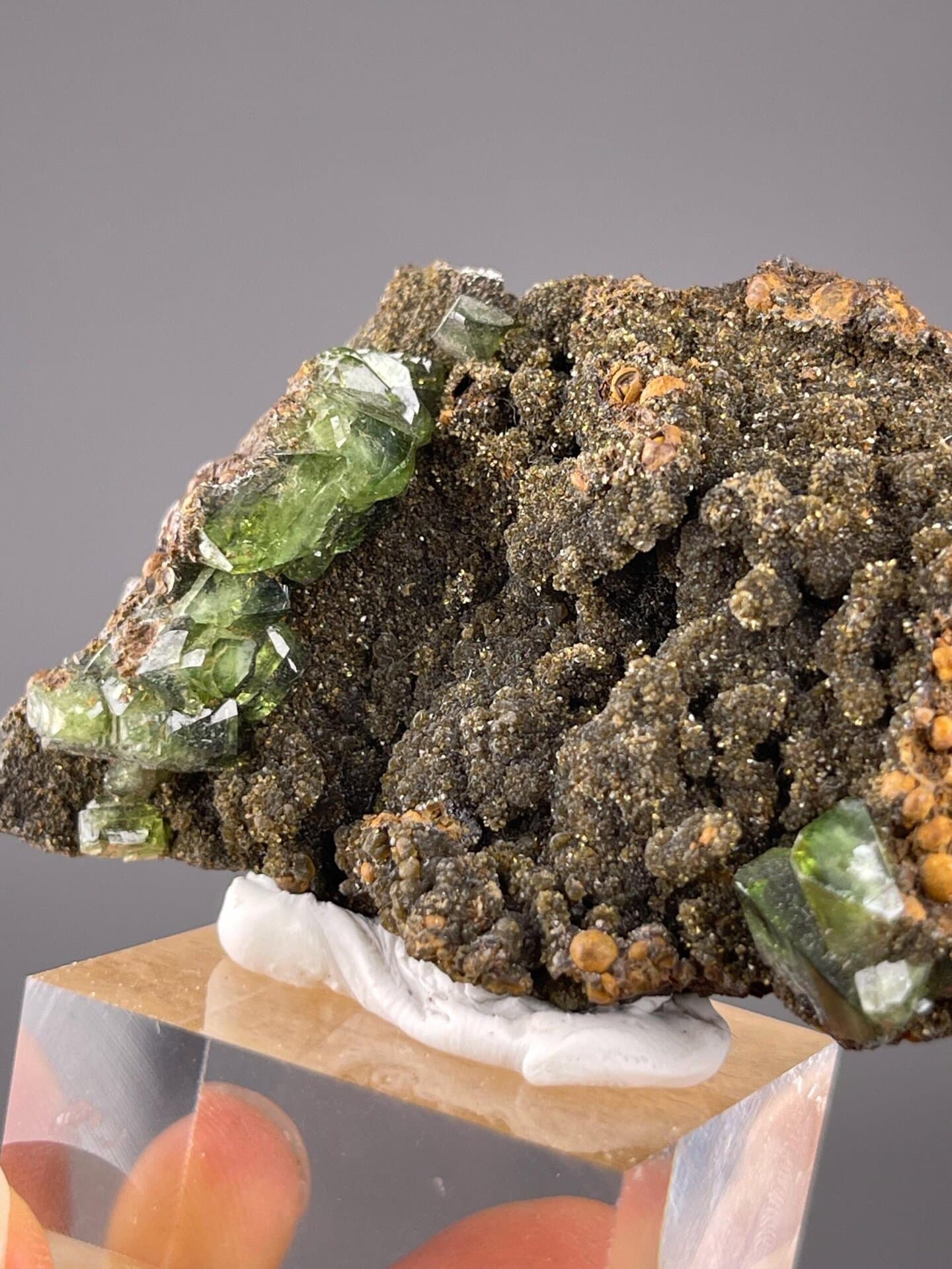 Unpolished green grossular garnet with natural crystal surfaces