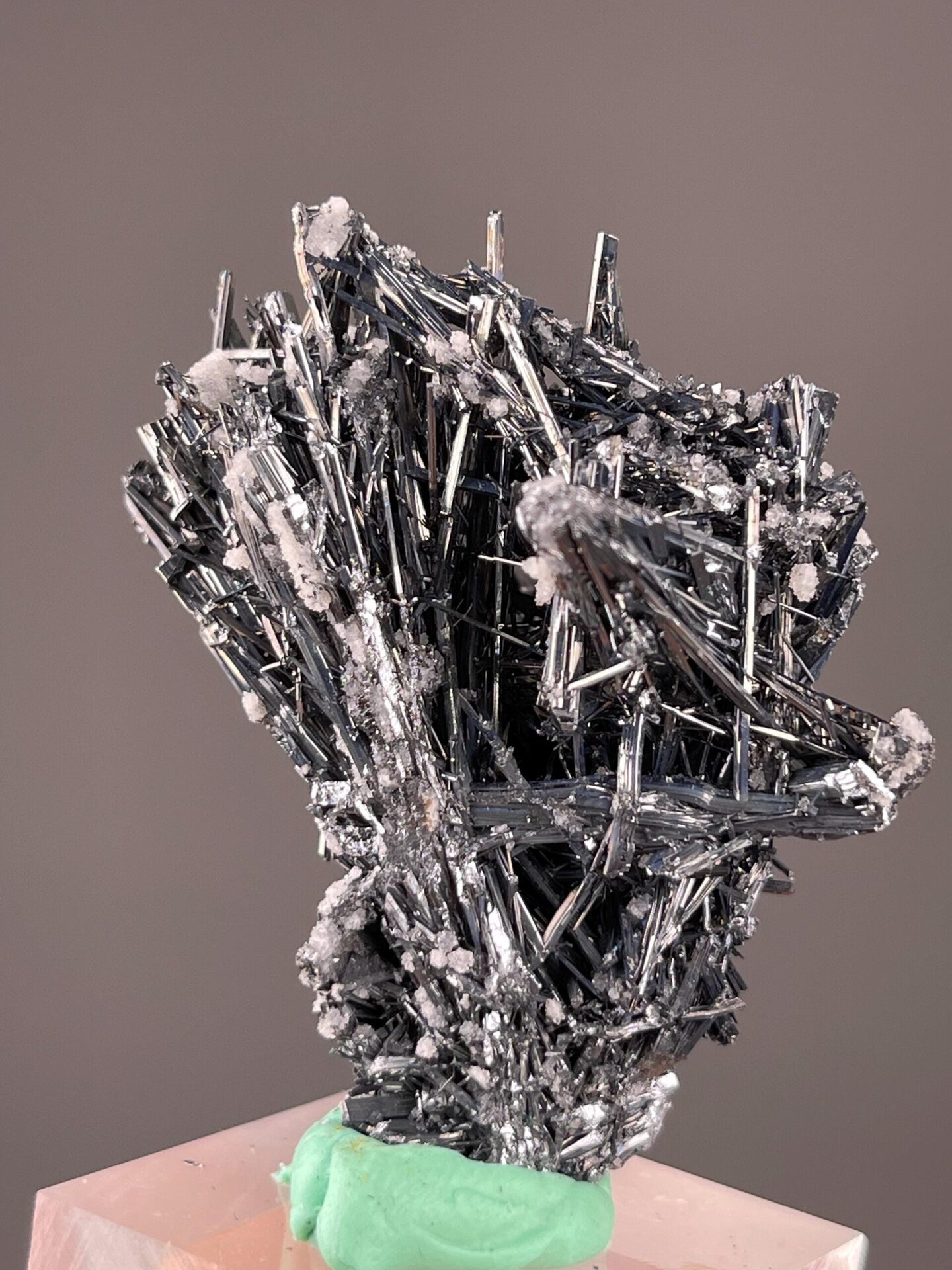 Sb₂S₃ orthorhombic stibnite with associated calcite crystals