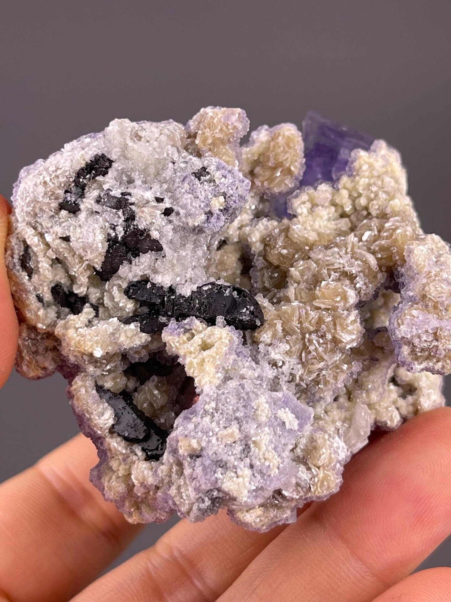 Yaogangxian purple fluorite with reflective mica association