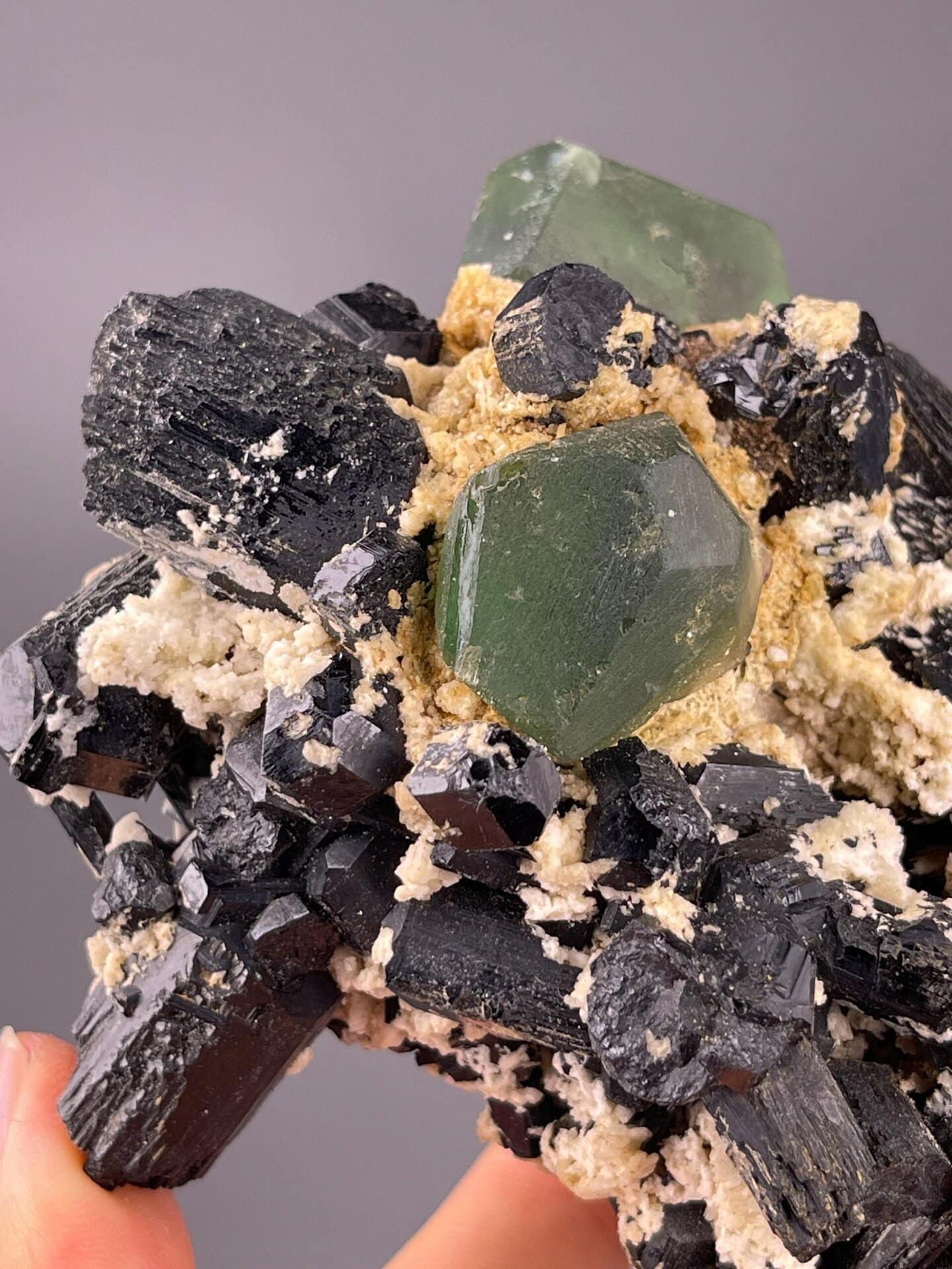 Tourmaline and fluorite cluster measuring 5.0×3.3×3.5 inches