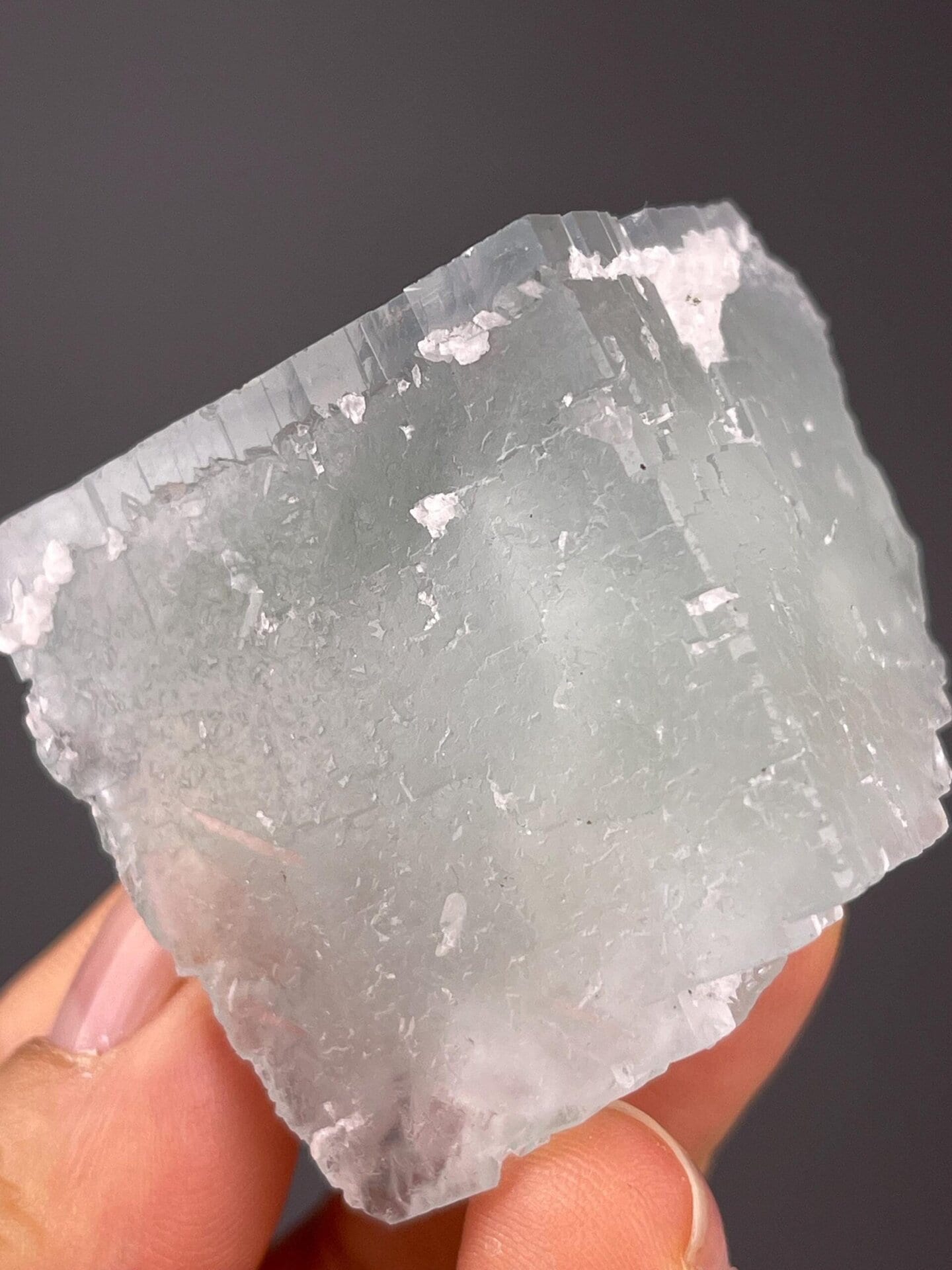 Angled view of blue fluorite with calcite inclusions