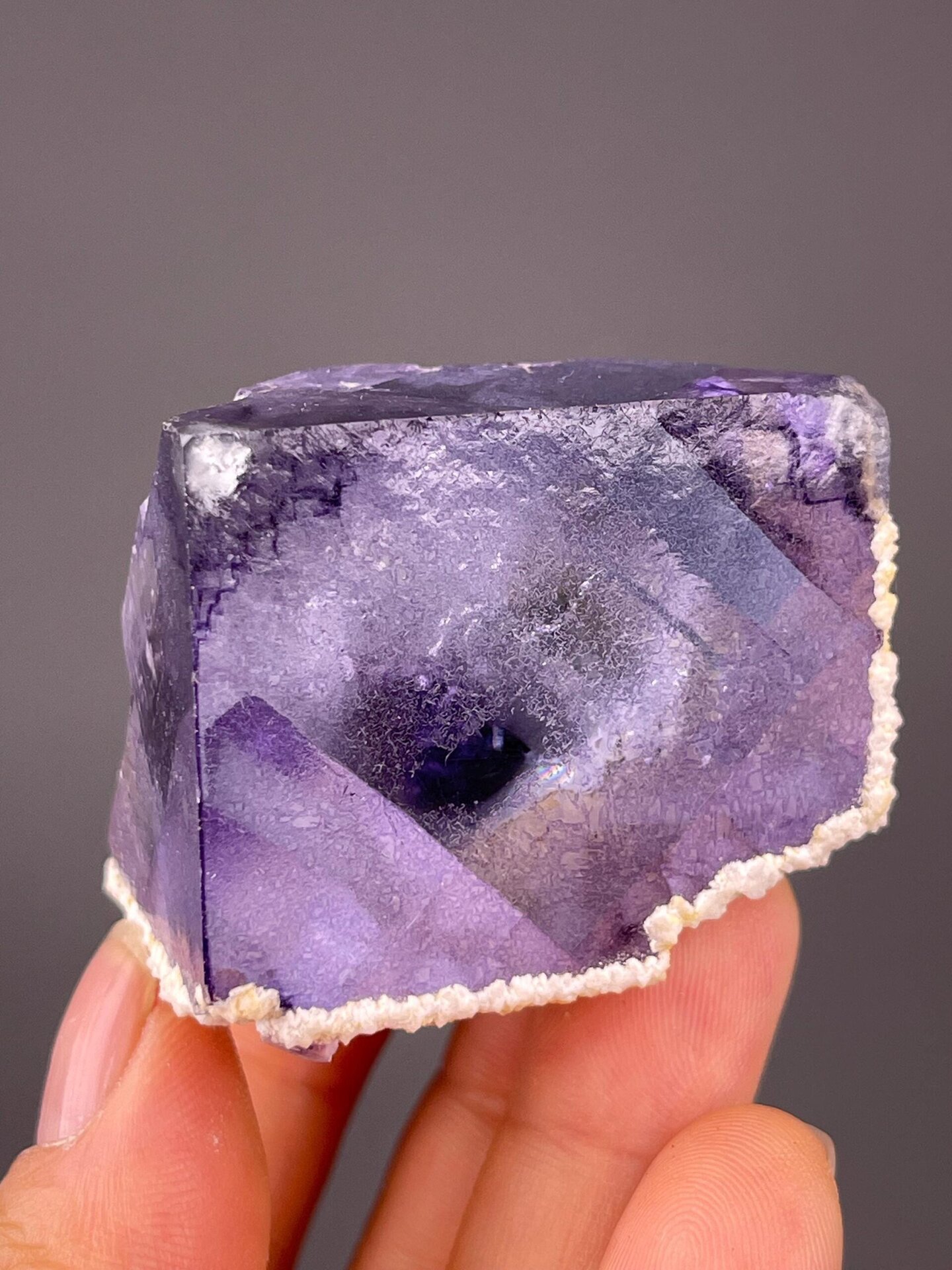 Close-up of purple phantom layers within fluorite cube