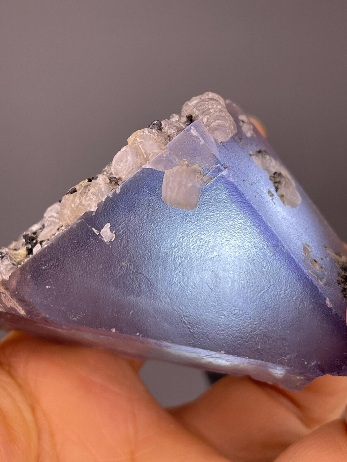 Purple fluorite triangular crystal with calcite, China