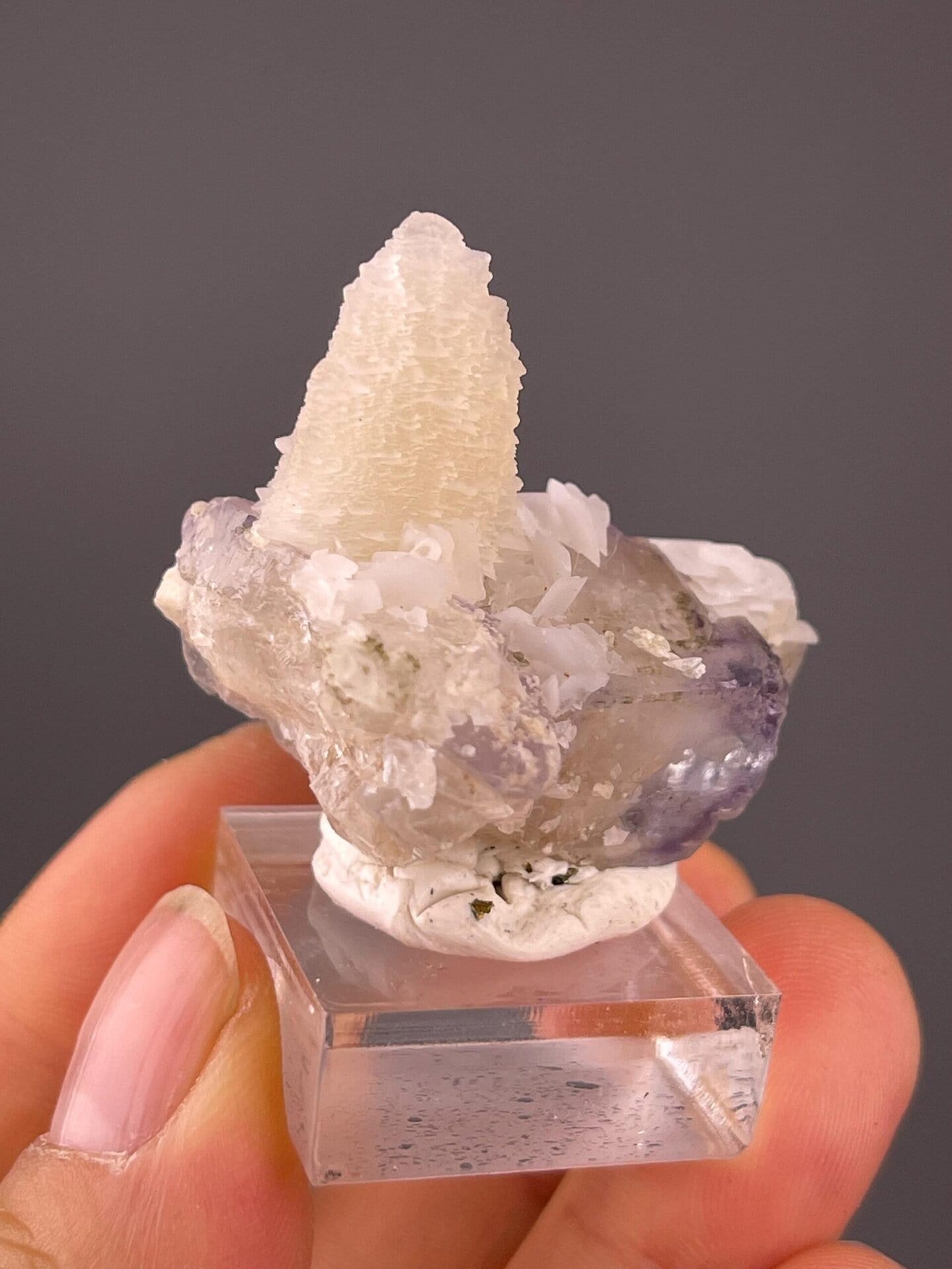 Stacked pagoda calcite crystals above fluorite base, YGX