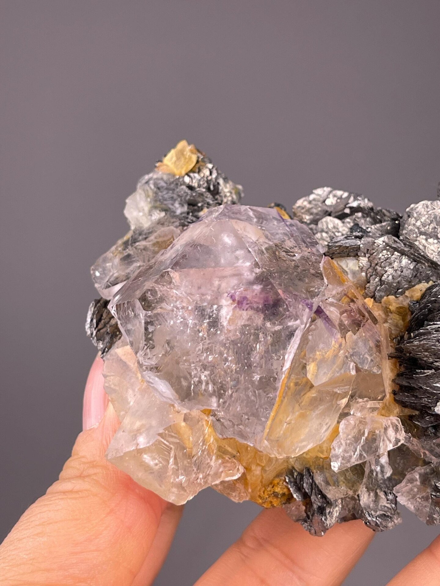 Phantom fluorite with radiating marcasite blades on matrix