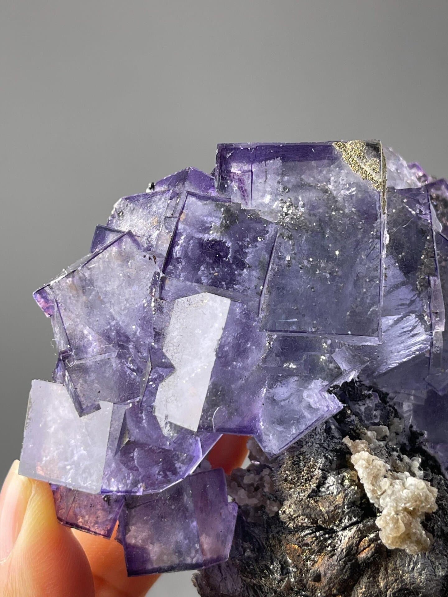 Translucent purple fluorite phantom cluster with pyrite accents