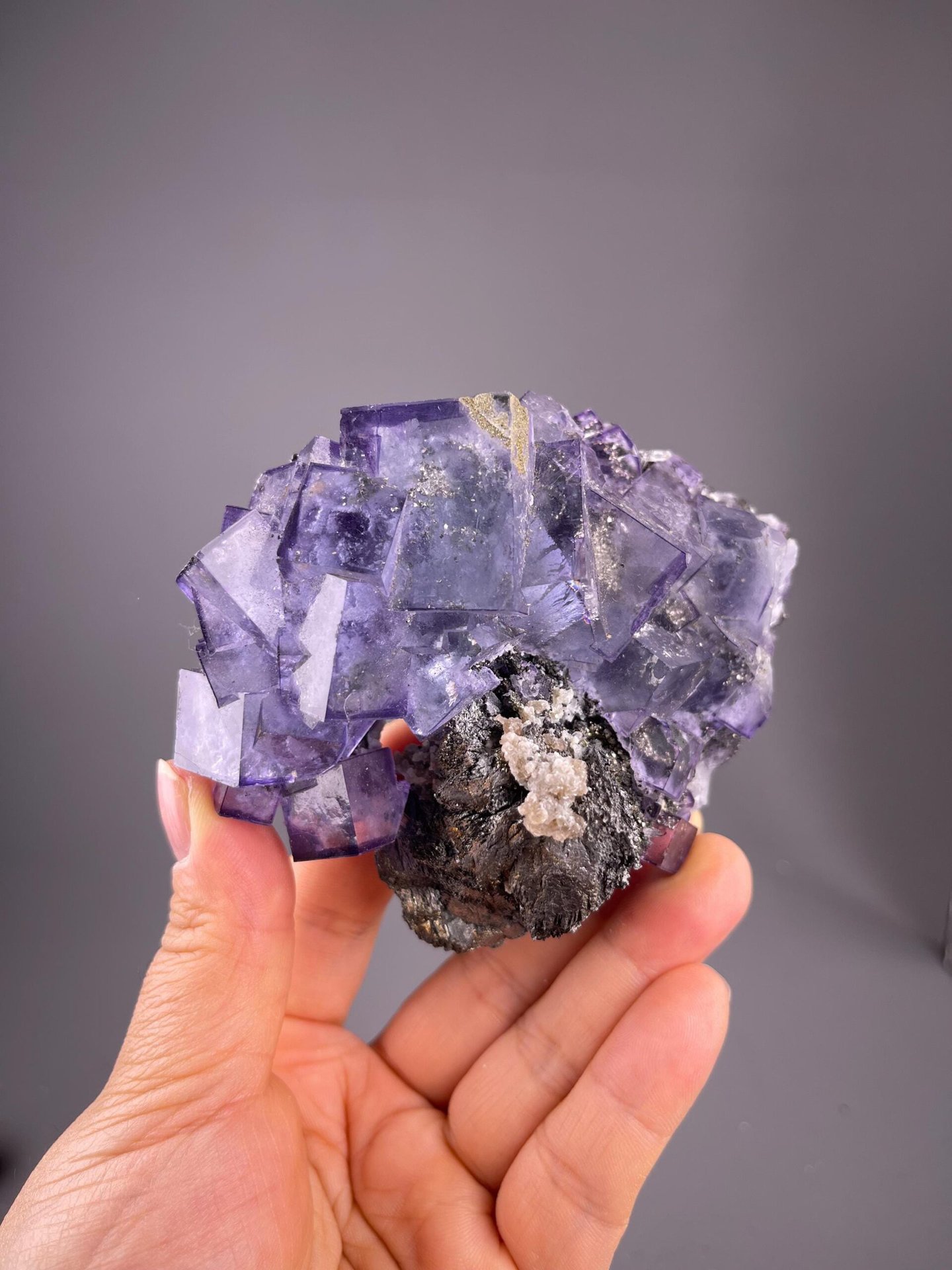 Collector purple phantom fluorite with pyrite from YGX Mine