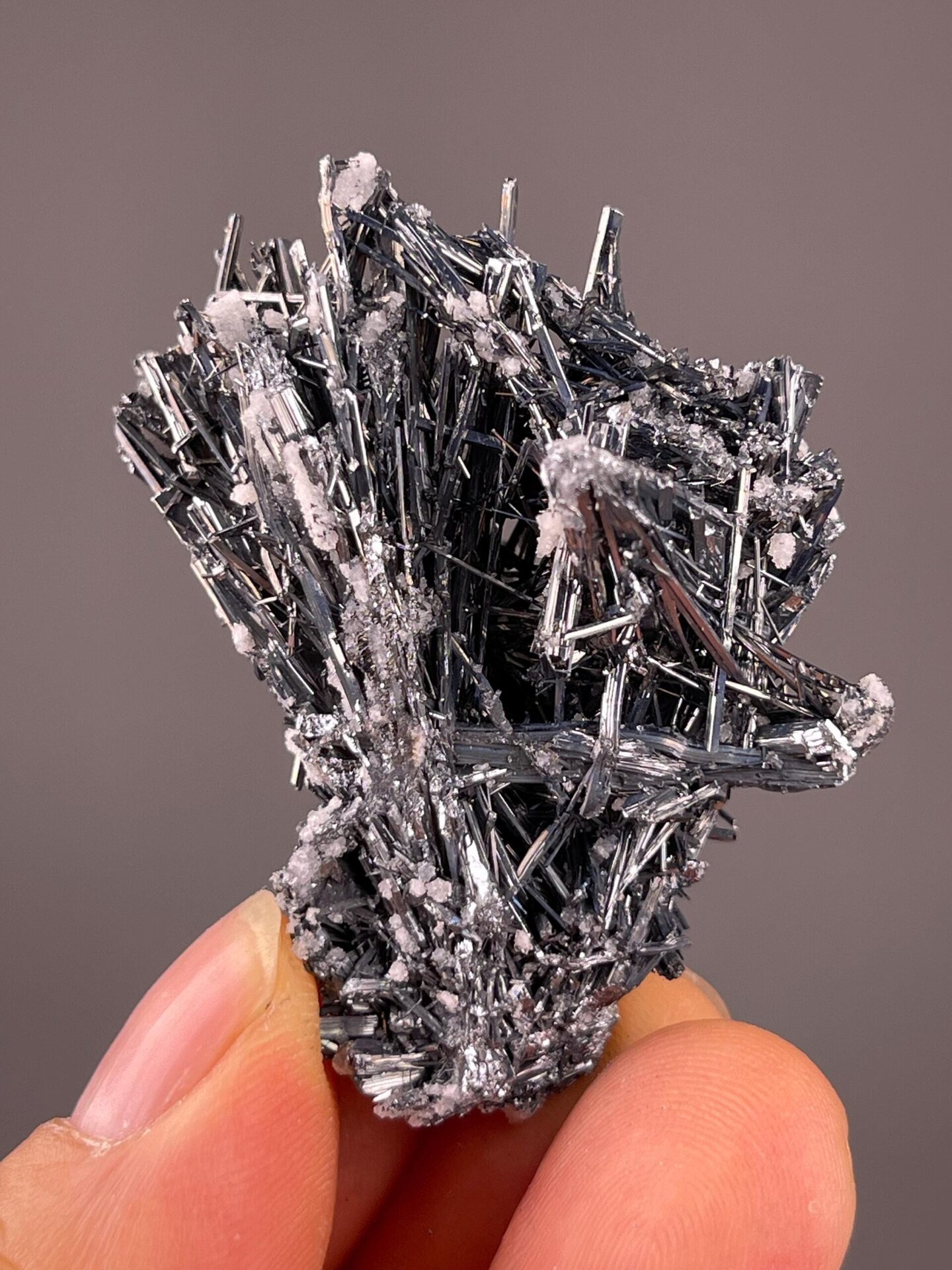 Well-formed stibnite crystal with calcite from Hunan