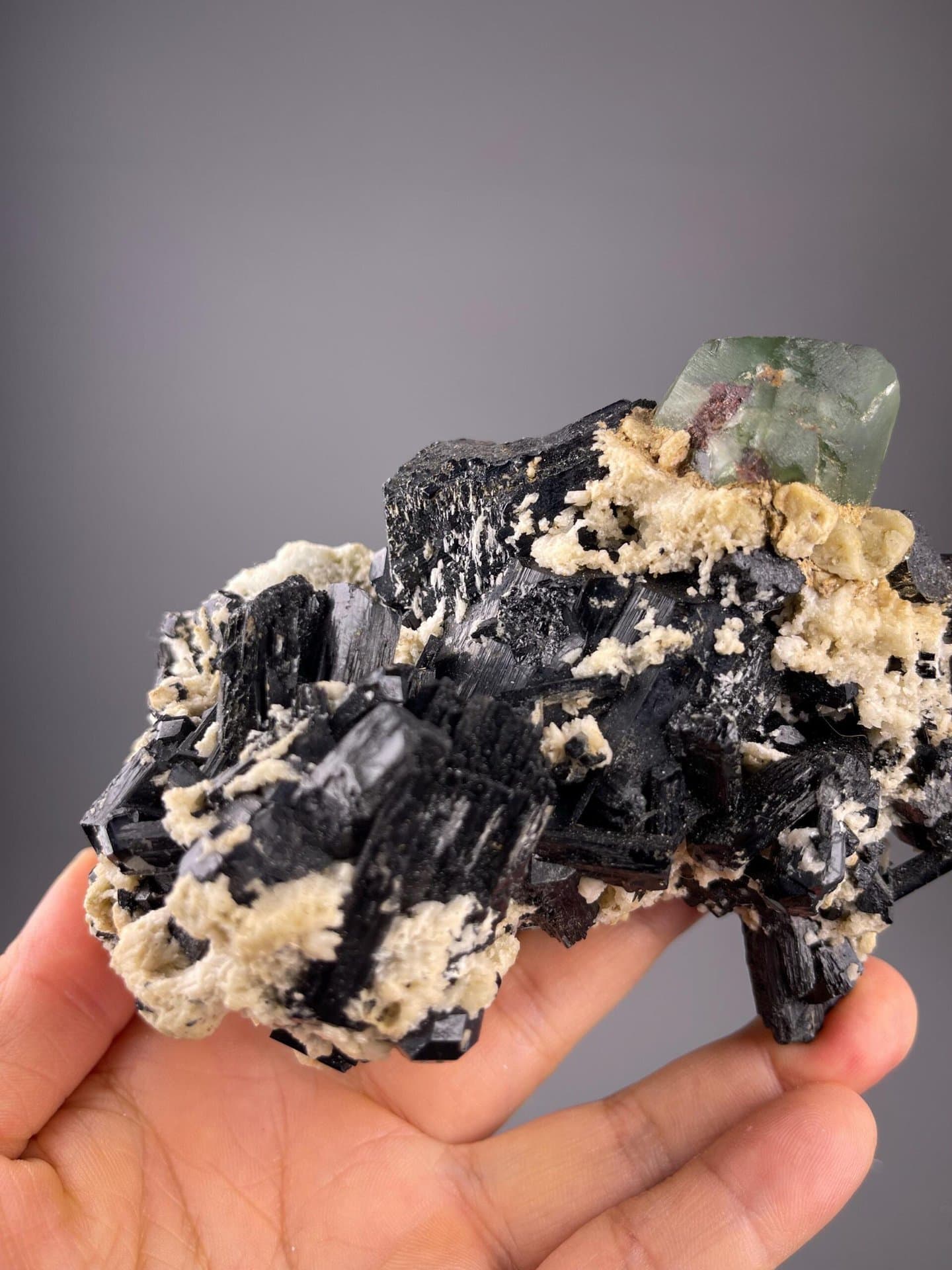 Striated black tourmaline crystals with green fluorite association