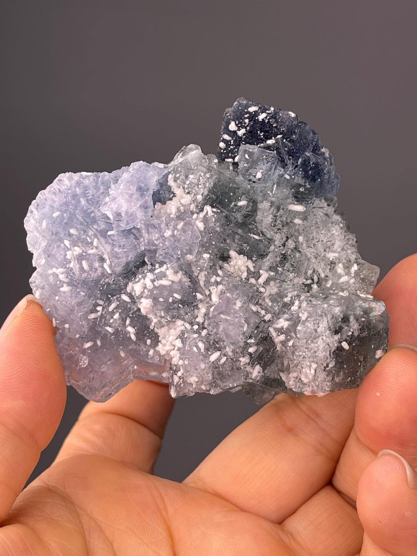 CaF₂ isometric fluorite with deep blue, sky blue, and green zones
