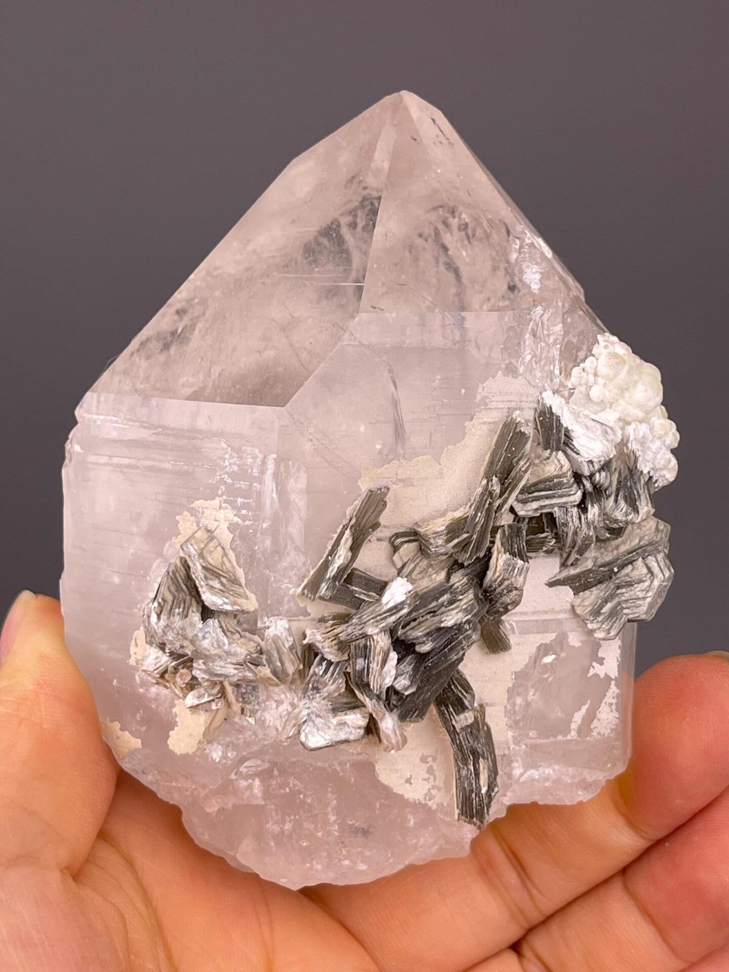 Quartz crystal with silver mica rosettes from skarn deposit