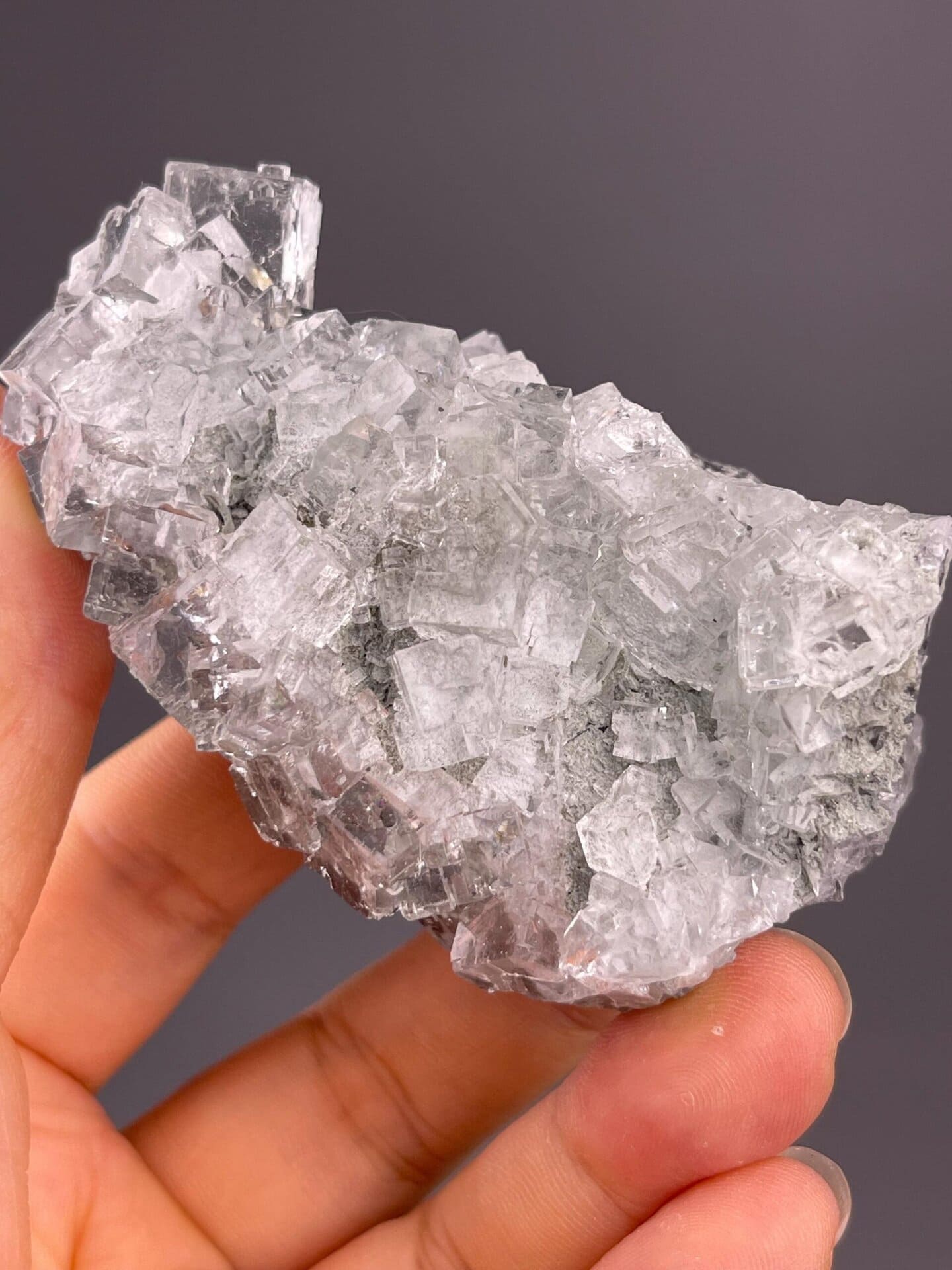 Clear fluorite crystal group with defined cubic crystal faces