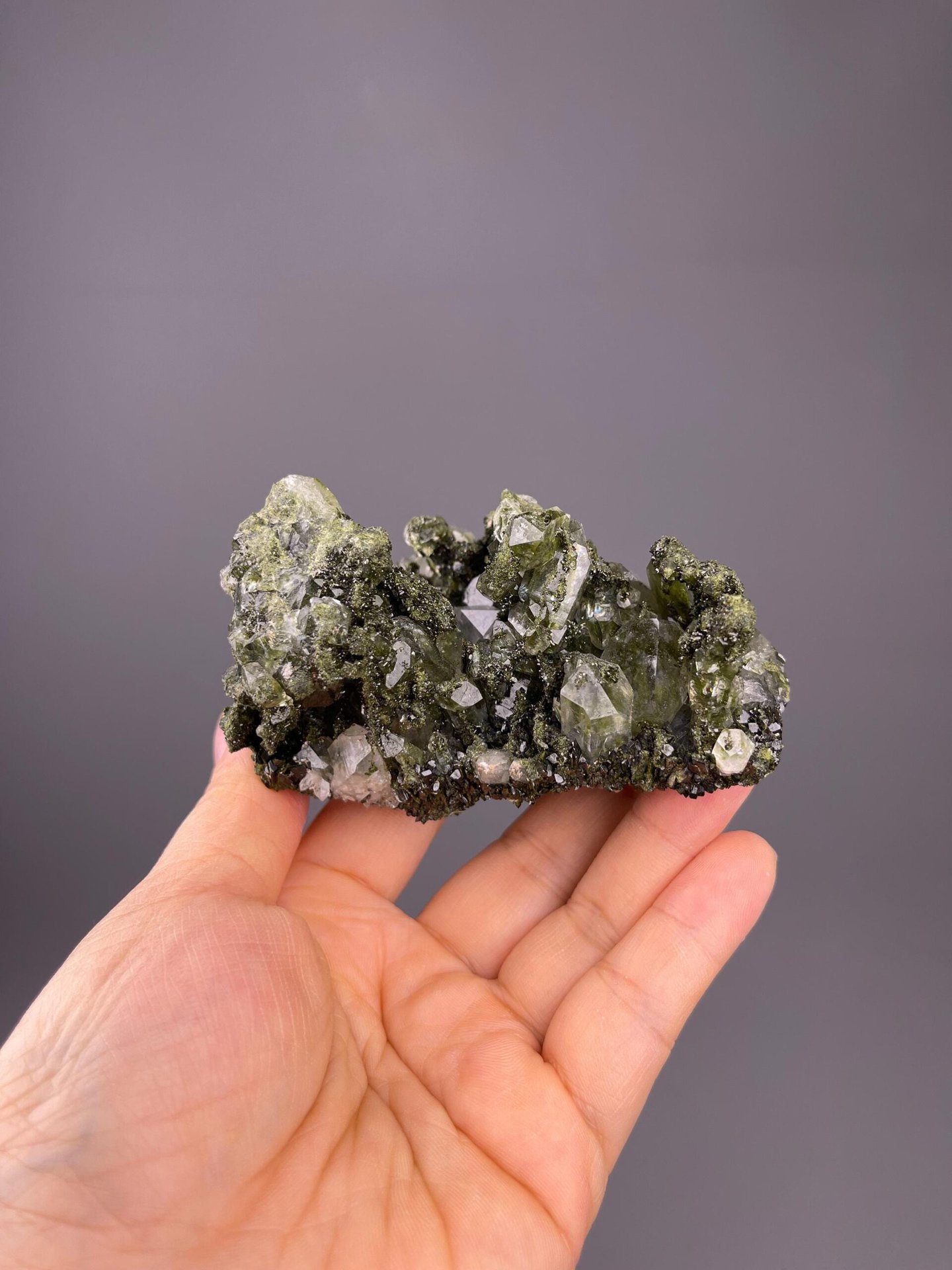 Quartz crystal with green chlorite phantom visible in interior