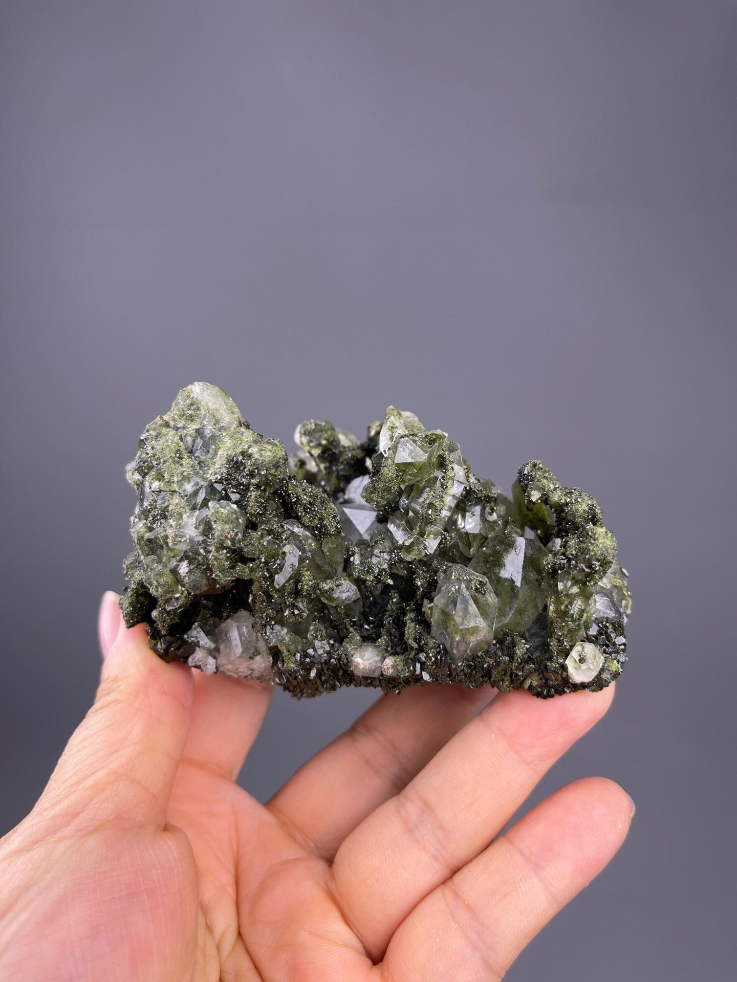 Natural quartz crystal showing chlorite phantom growth zones