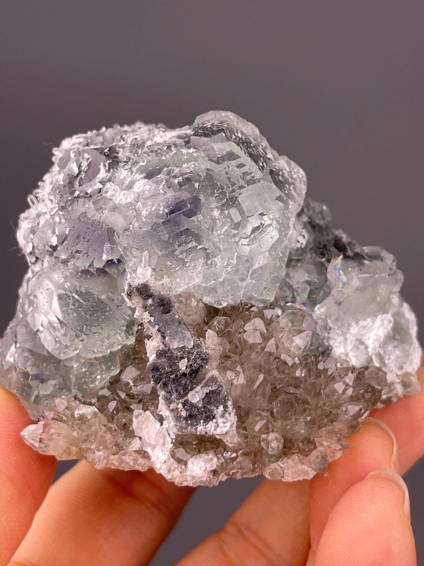 Botryoidal green fluorite clusters on white quartz matrix