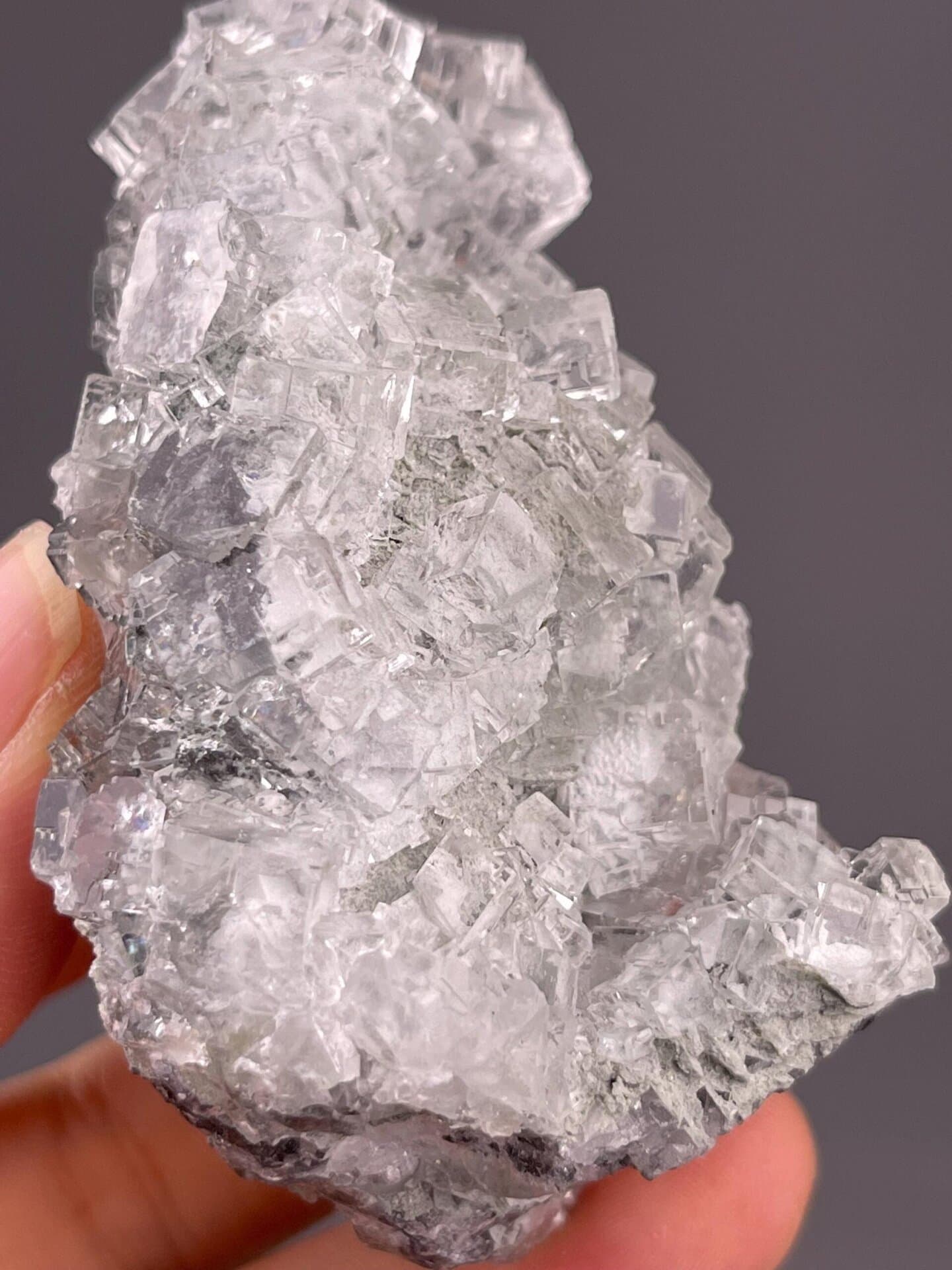 Colorless fluorite cluster from Xianghualing Mine with vitreous luster