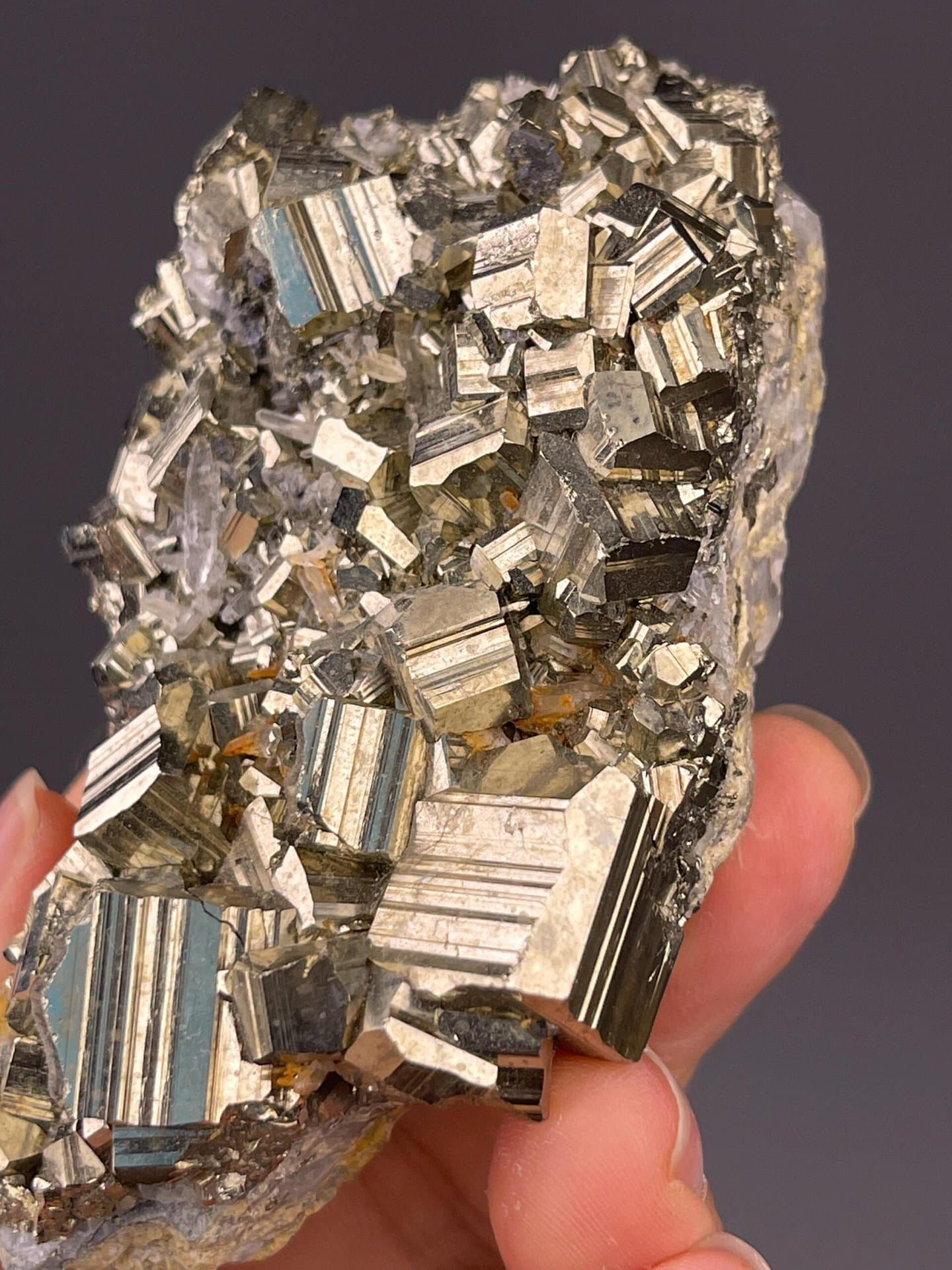 Detail of pyrite cube faces with natural reflectivity