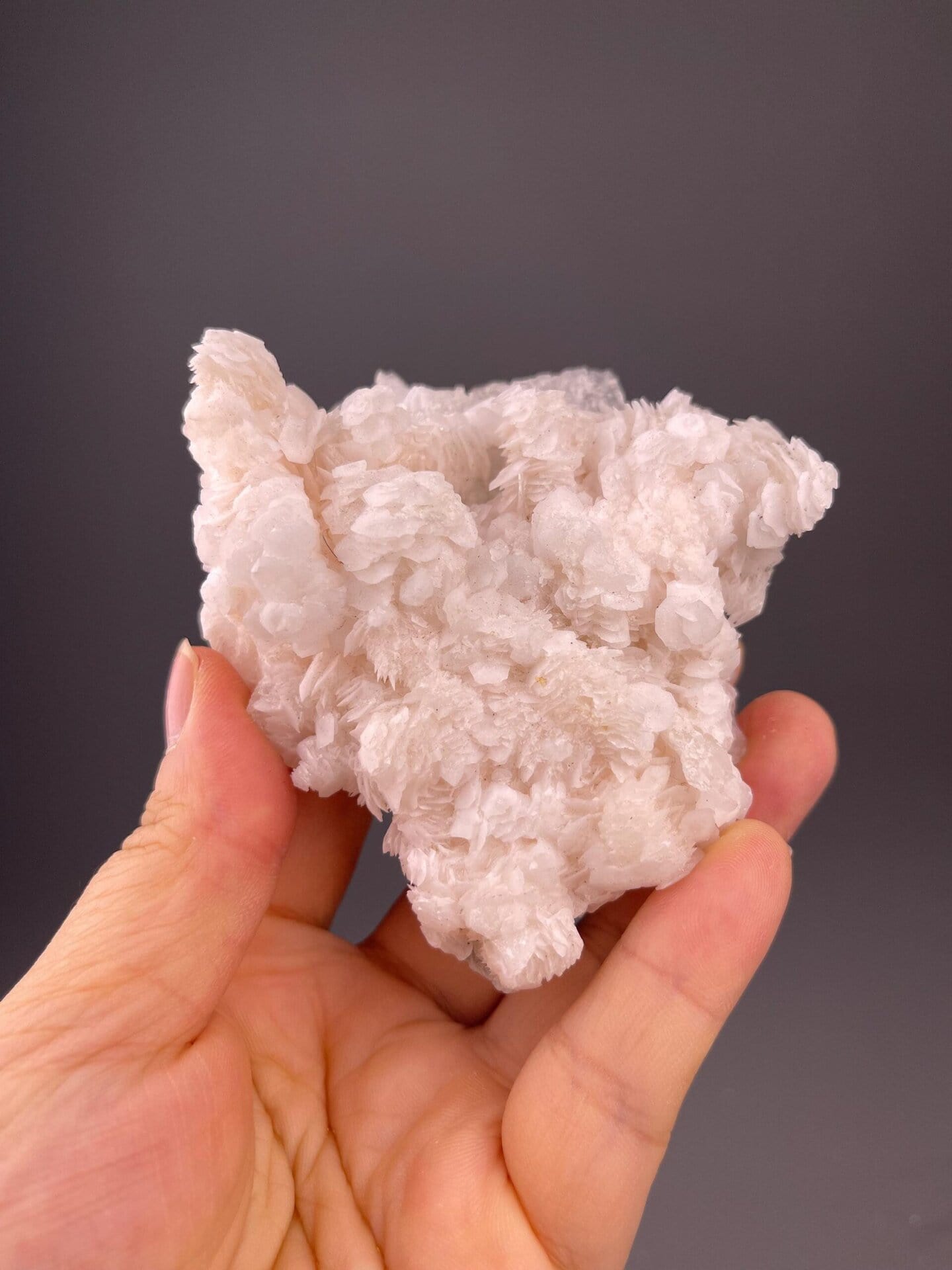 Front view of pink calcite flower cluster, 3.4×1.1×2.9 in