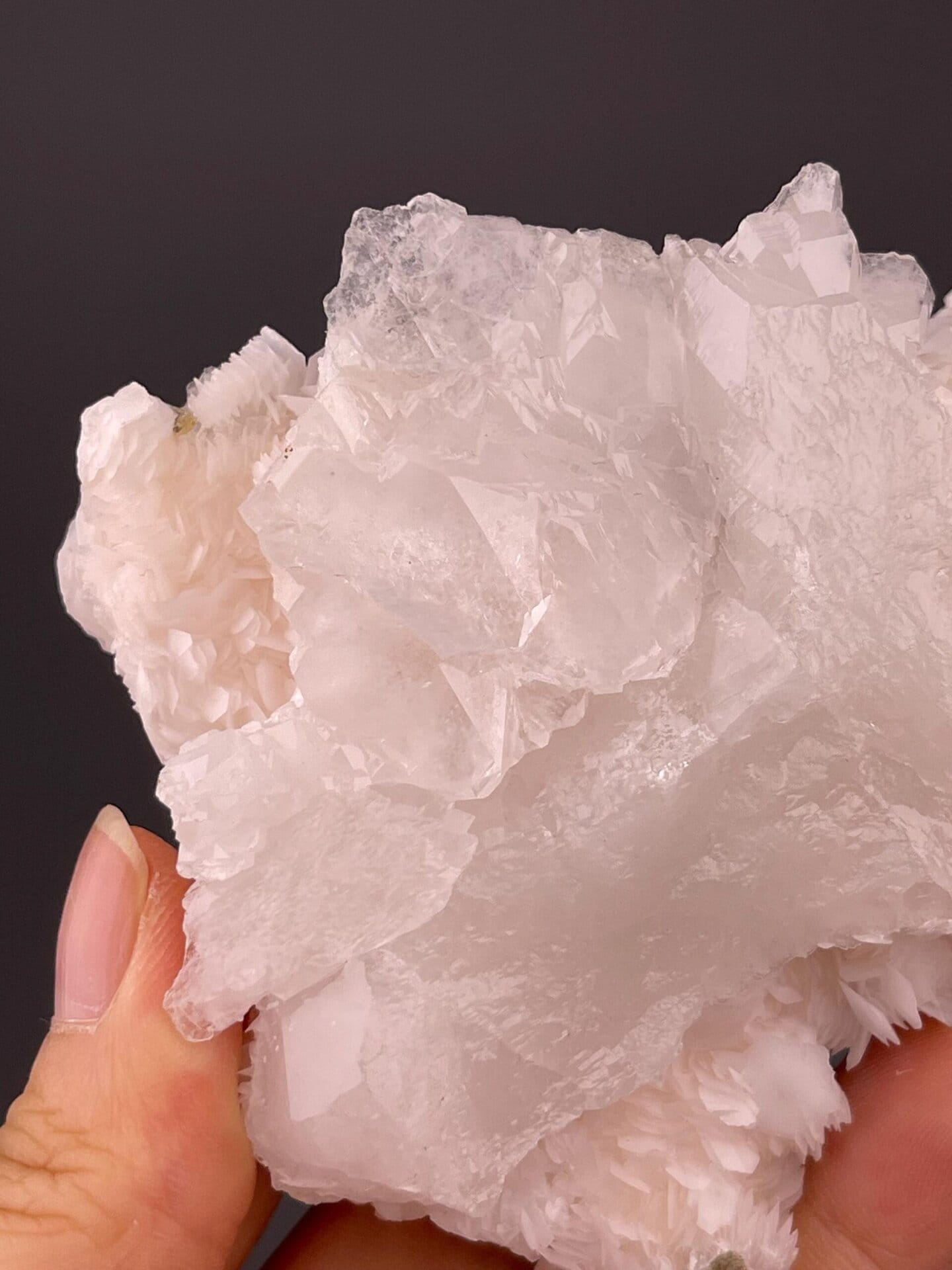 Angled view of pink calcite flower cluster