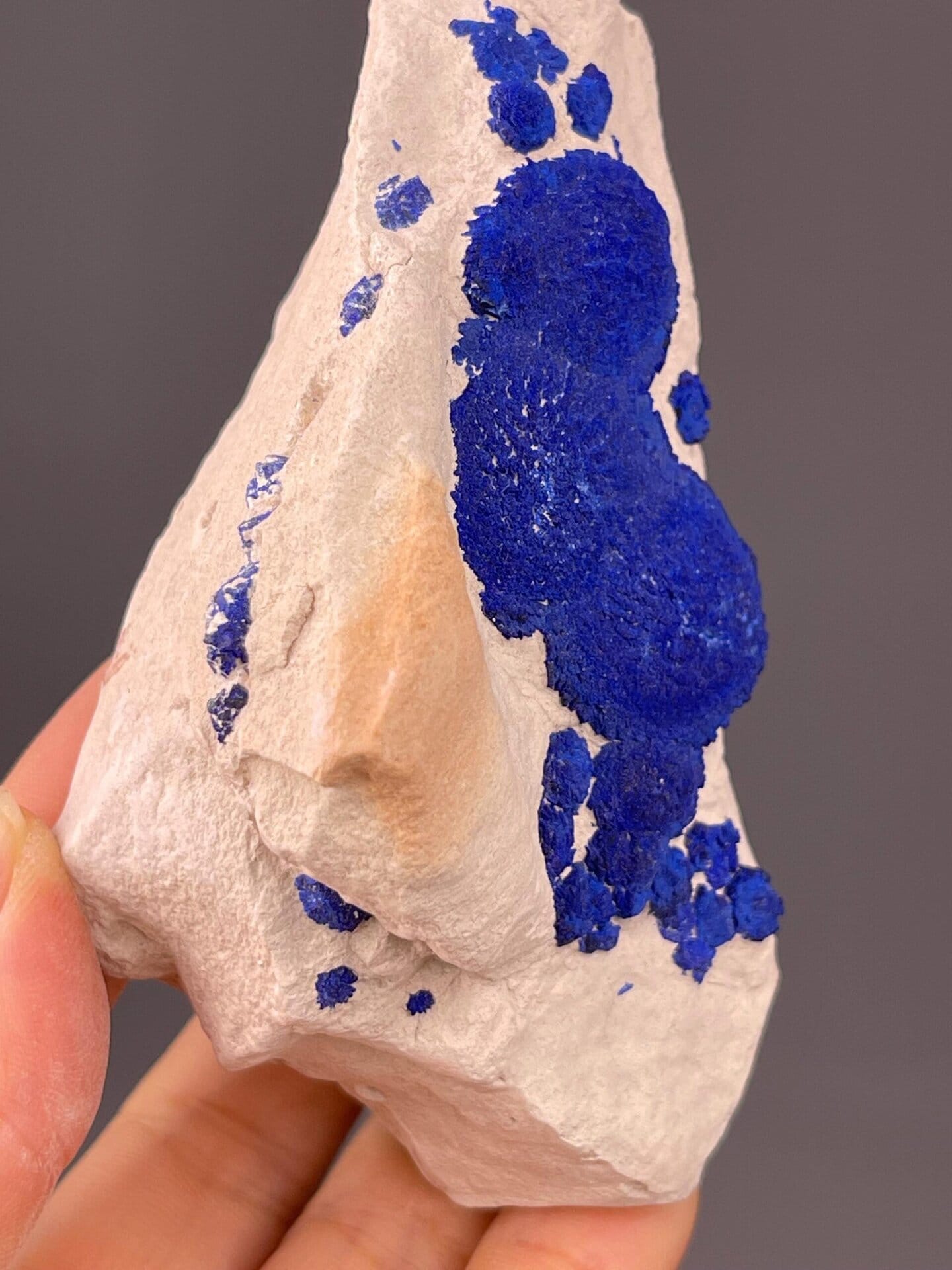 Angled view highlighting vivid blue azurite rosettes