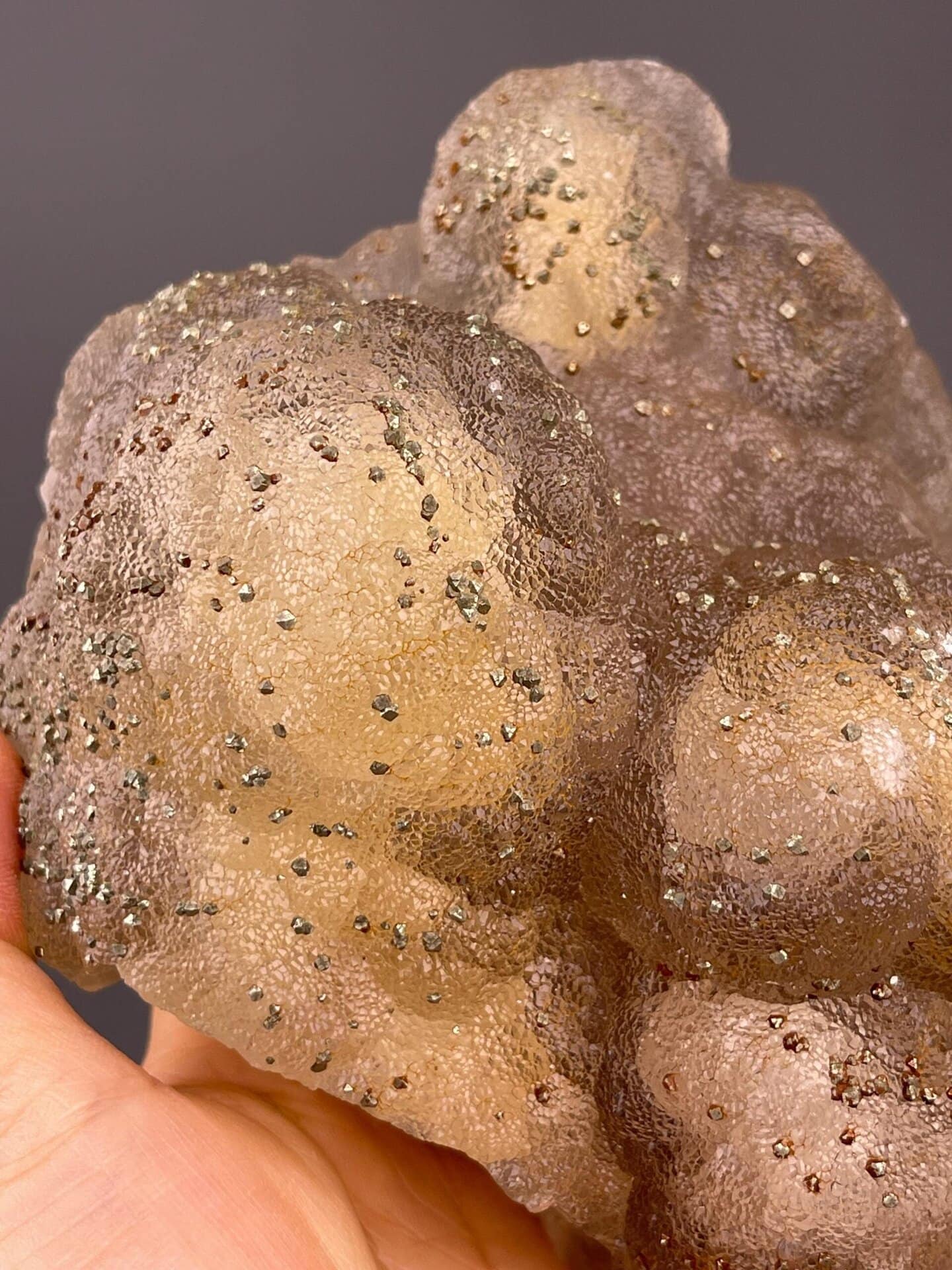 Side view of botryoidal fluorite showing globular formations