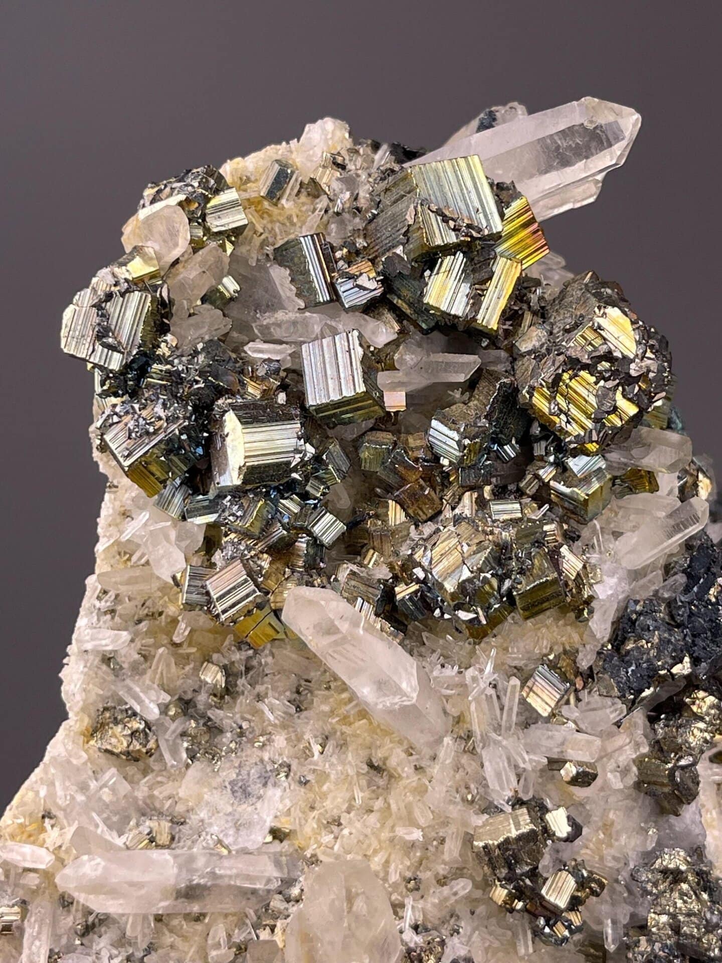Angled view of cubic pyrite cluster showing gold metallic colour