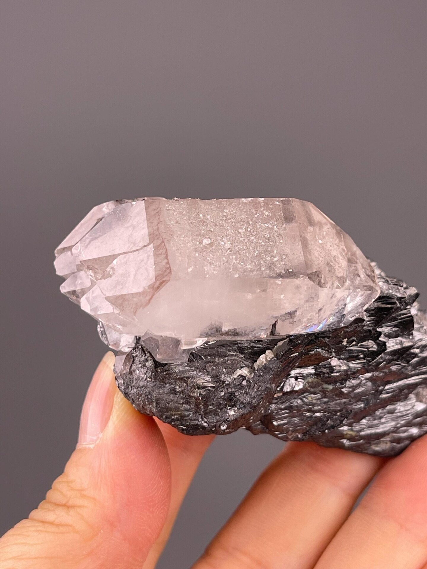 Detail of cassiterite crystal morphology on quartz
