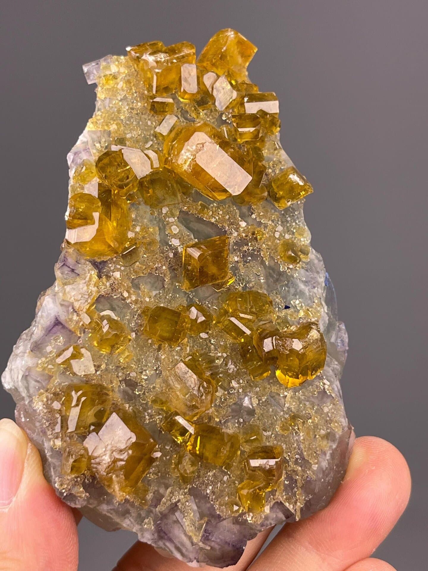 Close-up of golden-yellow fluorite crystals showing vitreous luster
