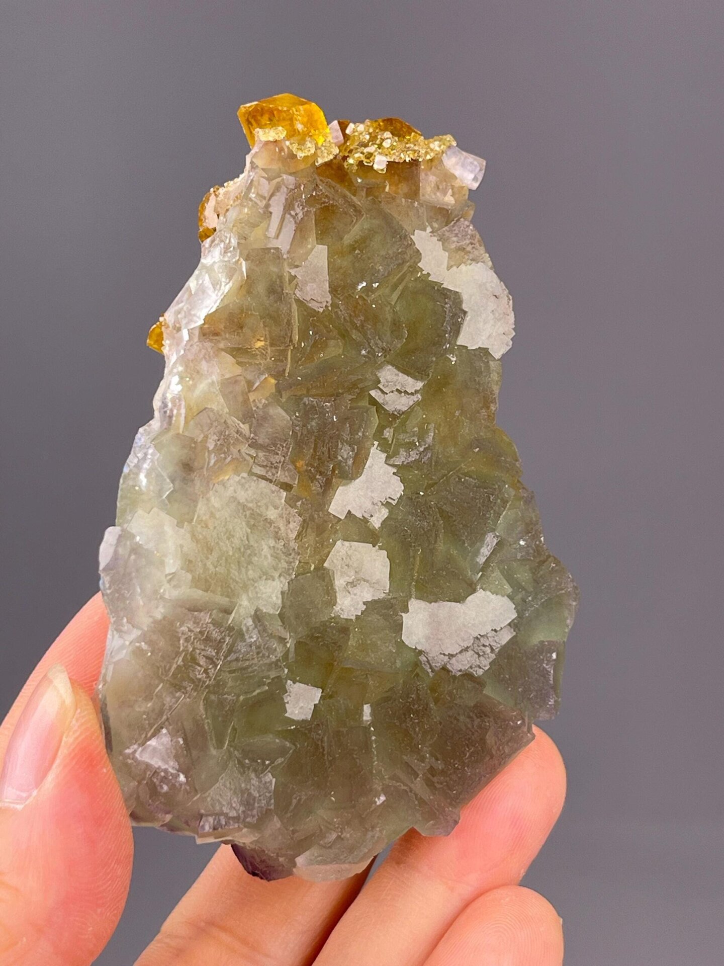 Detail of fluorite crystal faces showing golden-yellow colour