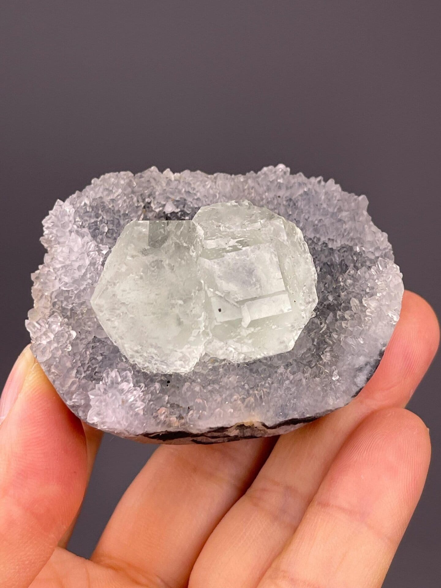 Close-up of green fluorite twin crystals showing vitreous luster