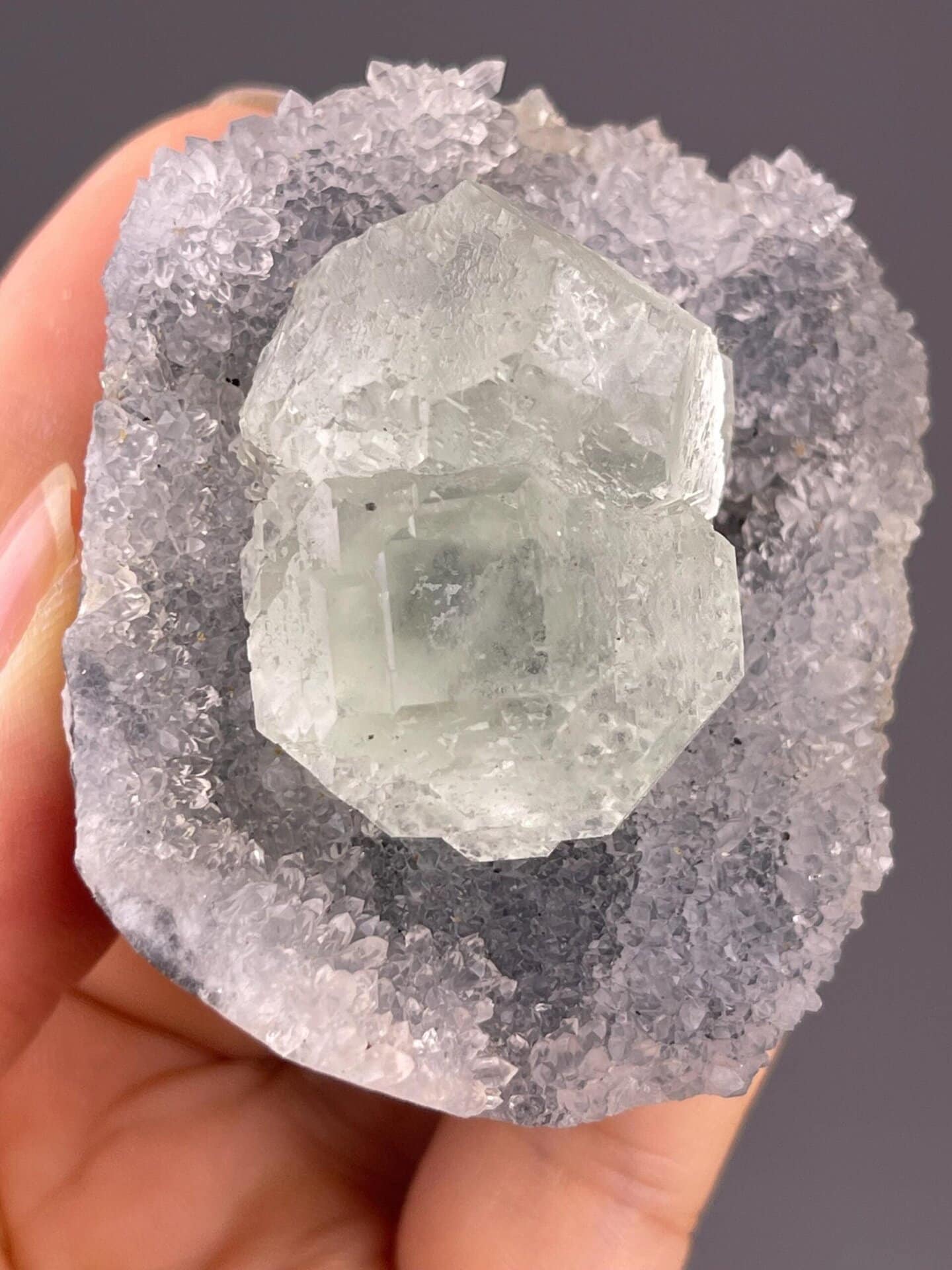 Back view of Fujian green fluorite twin crystals on quartz