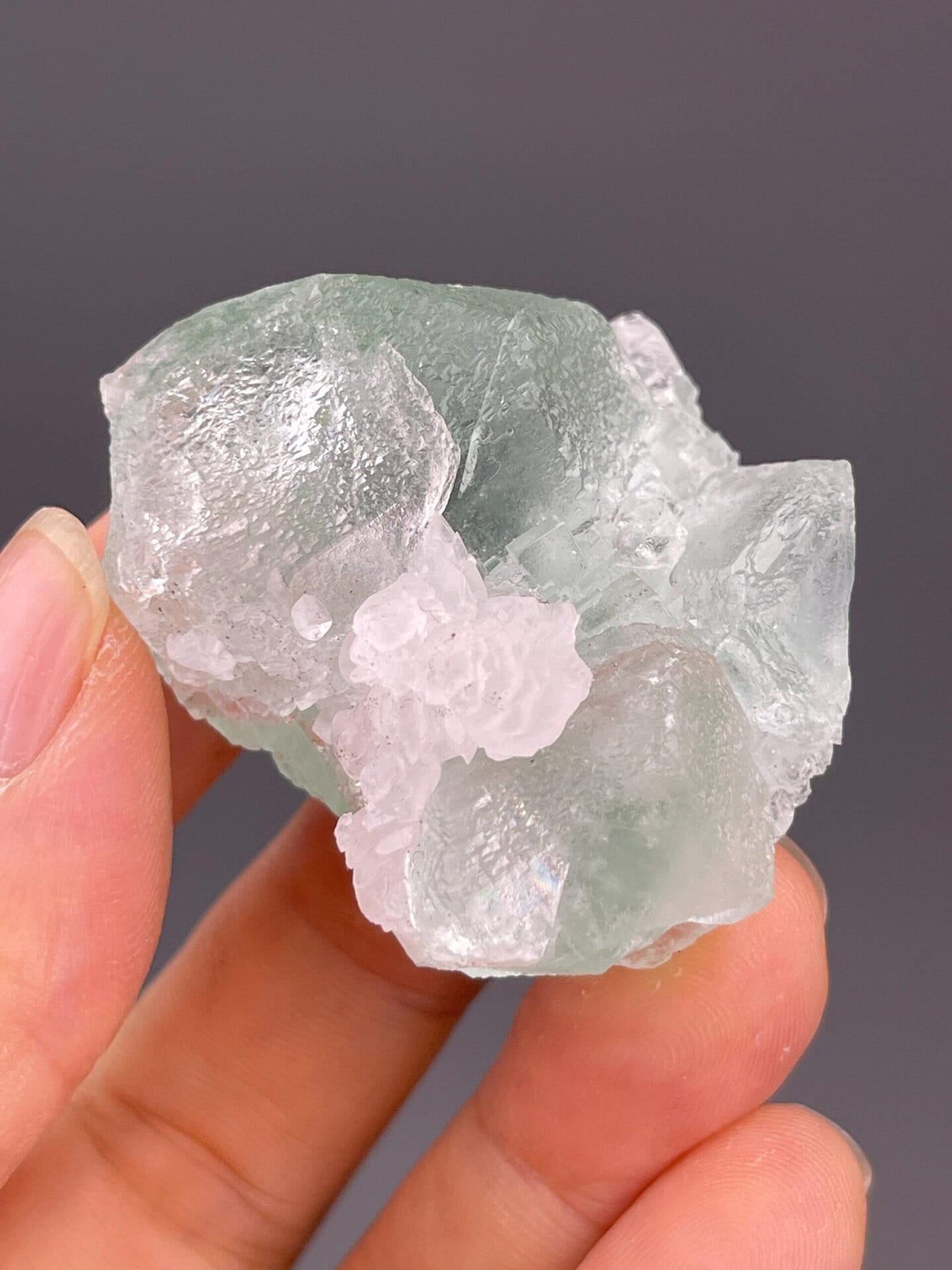 Back view of mint green fluorite with calcite
