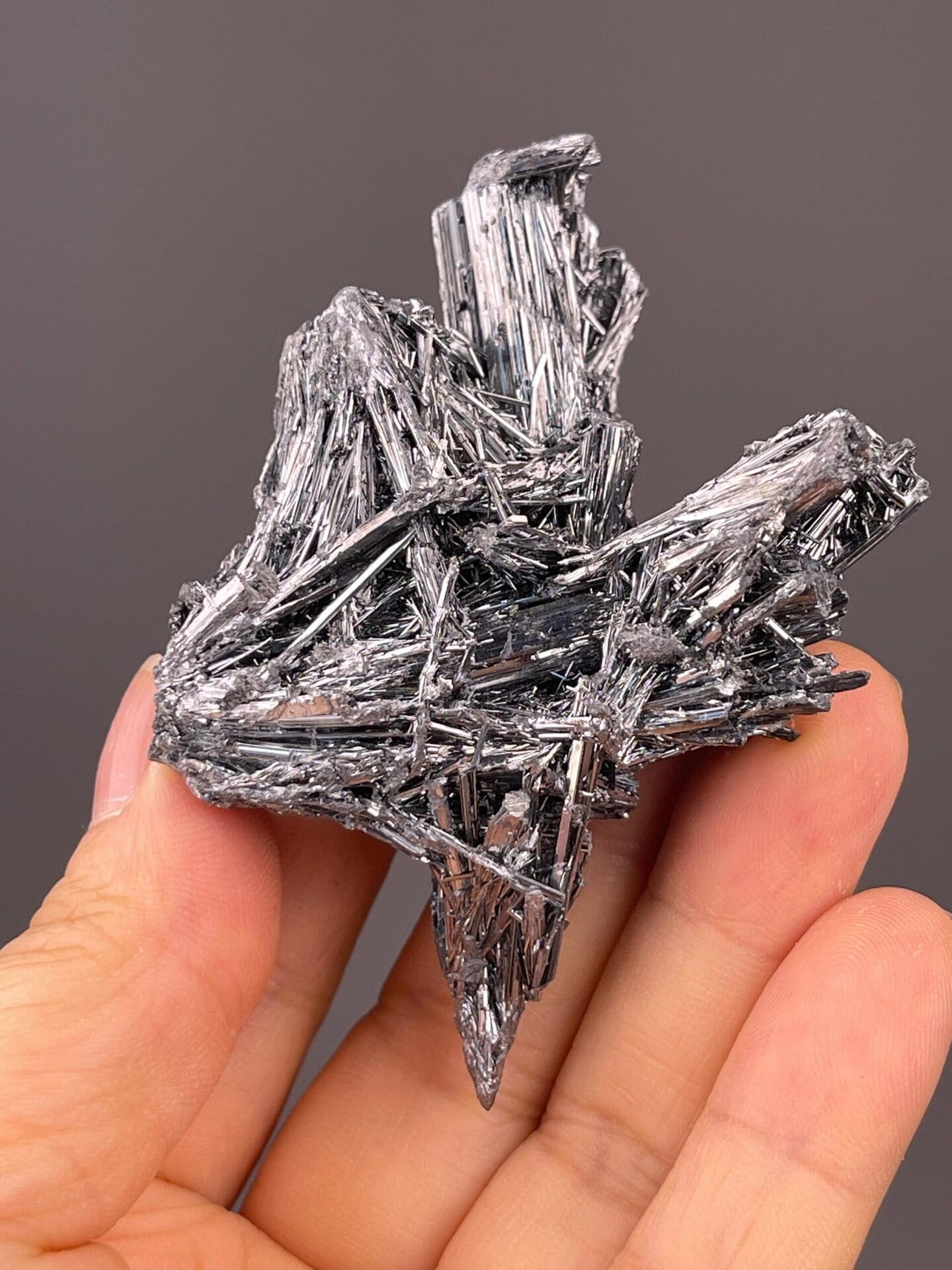 Side view of stibnite cluster, 2.5×1.7×1 in, Hunan