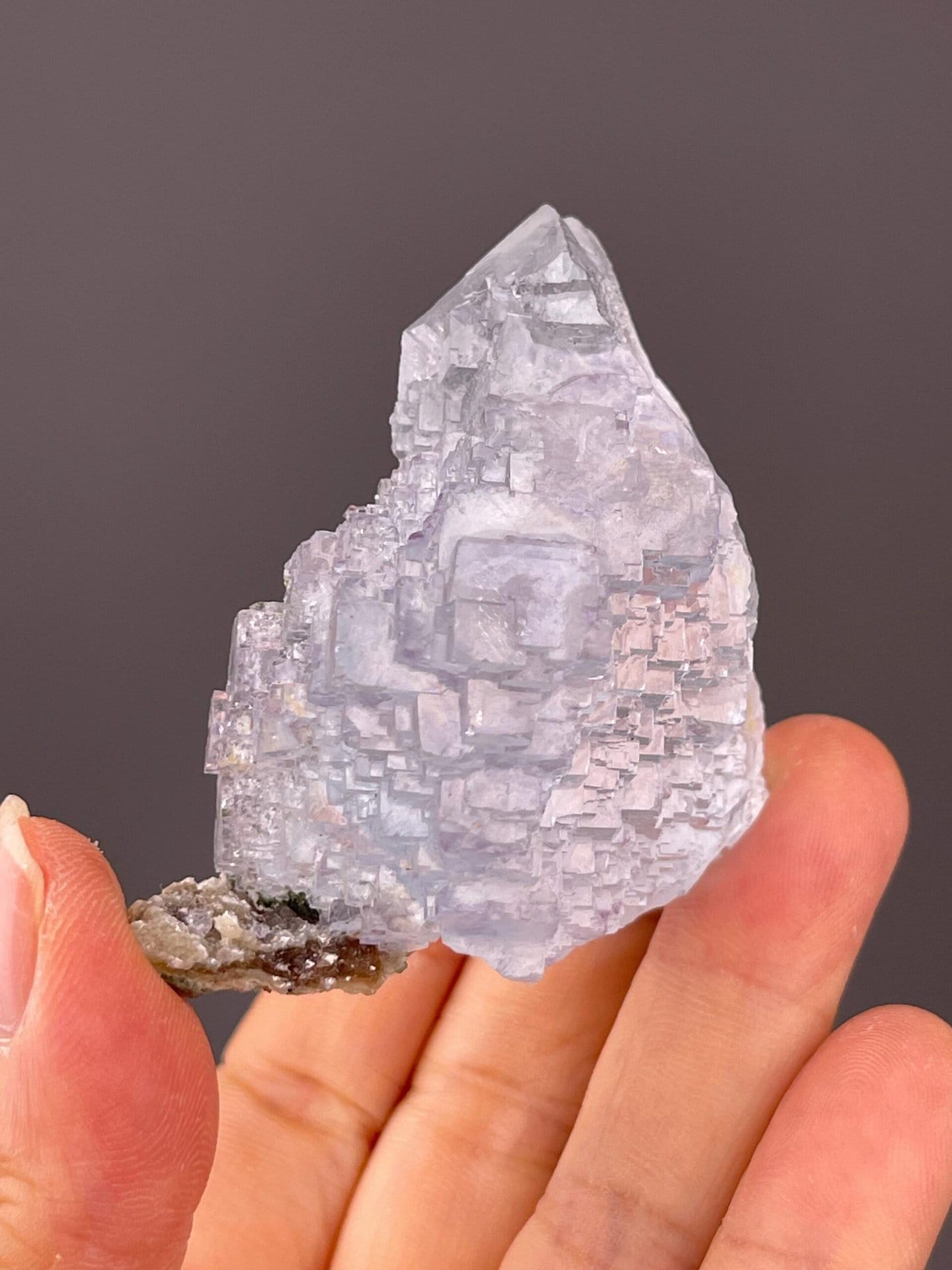 Close-up of blue fluorite crystal faces showing vitreous luster