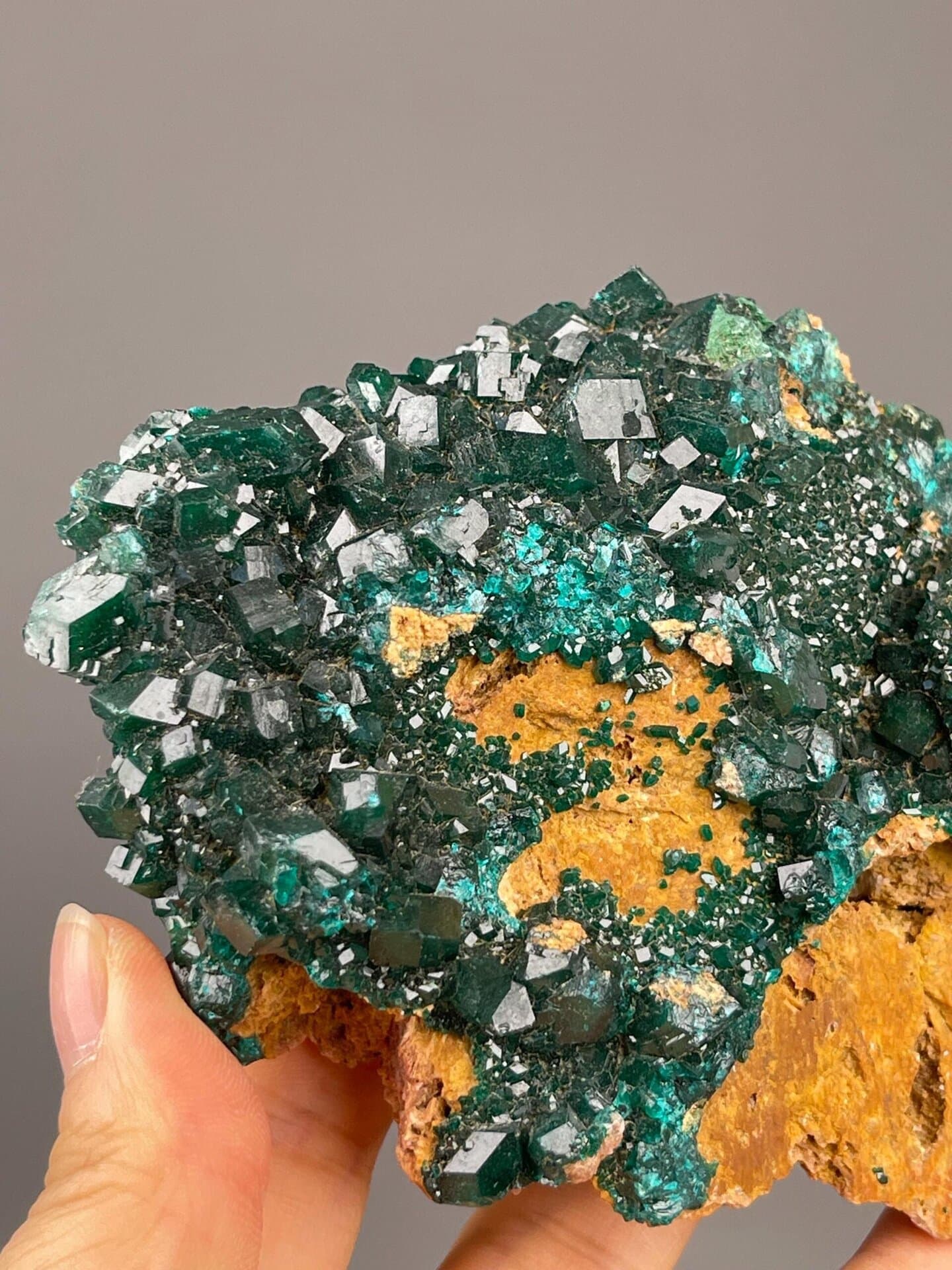 Close-up of dioptase crystals showing deep emerald green