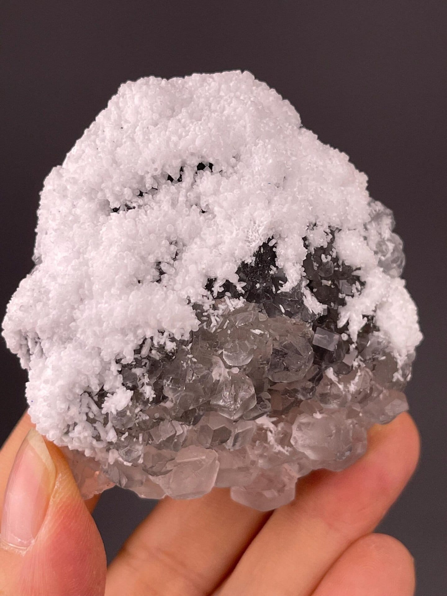 Close-up of sparkling druzy quartz coating on green fluorite