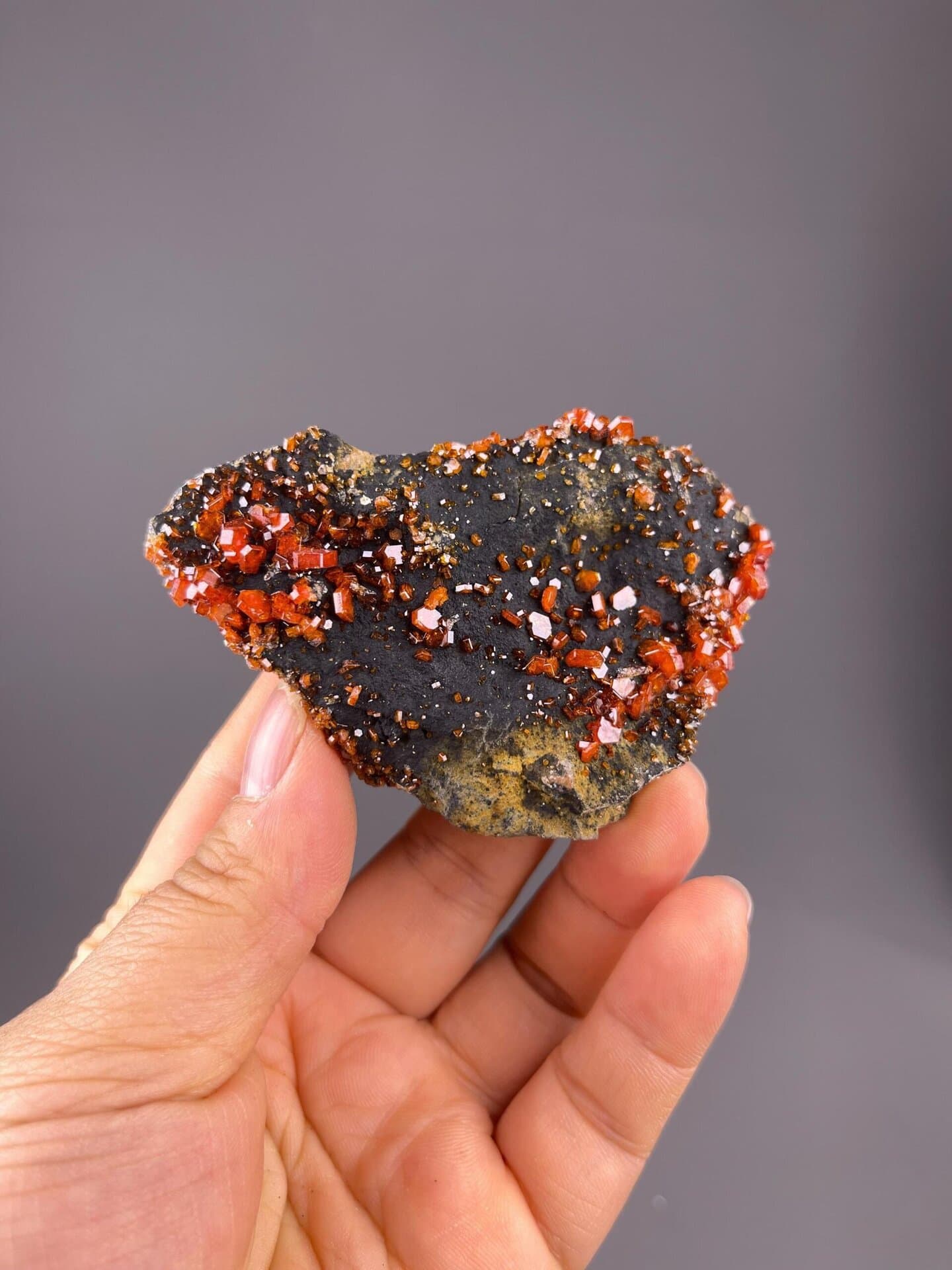 Close-up of deep red vanadinite hexagonal crystal prisms
