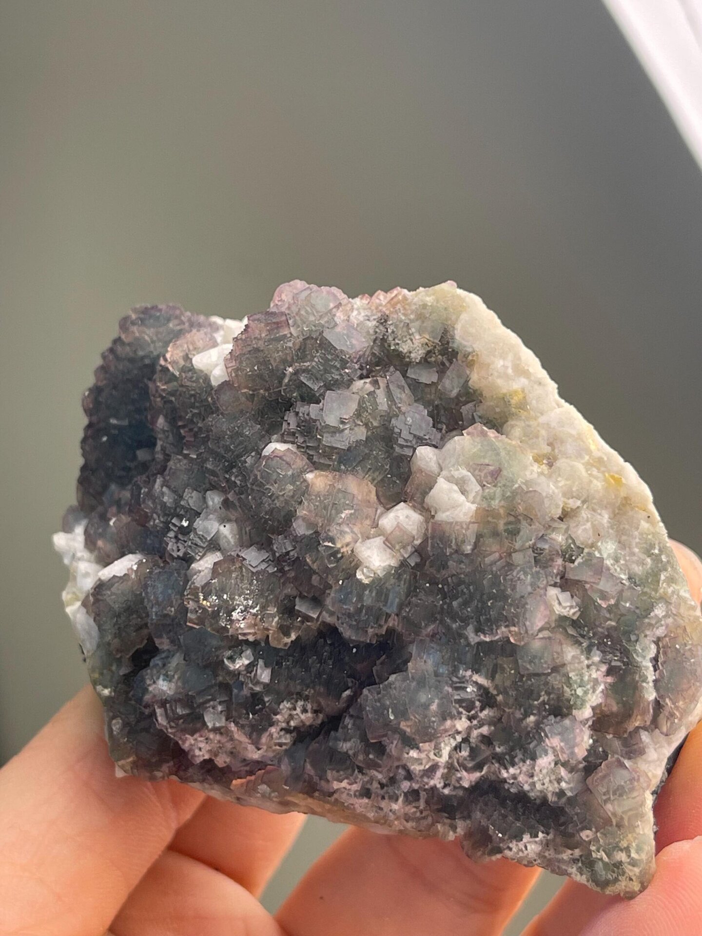 Close-up of purple edge zoning on green fluorite crystals