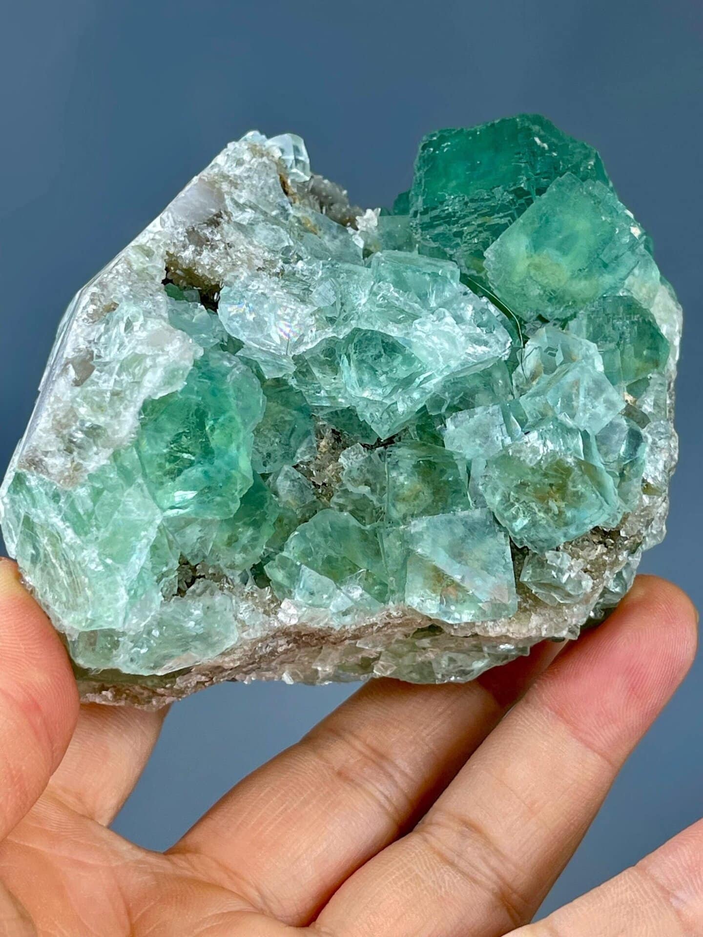 Close-up of transparent apple-green fluorite crystal faces