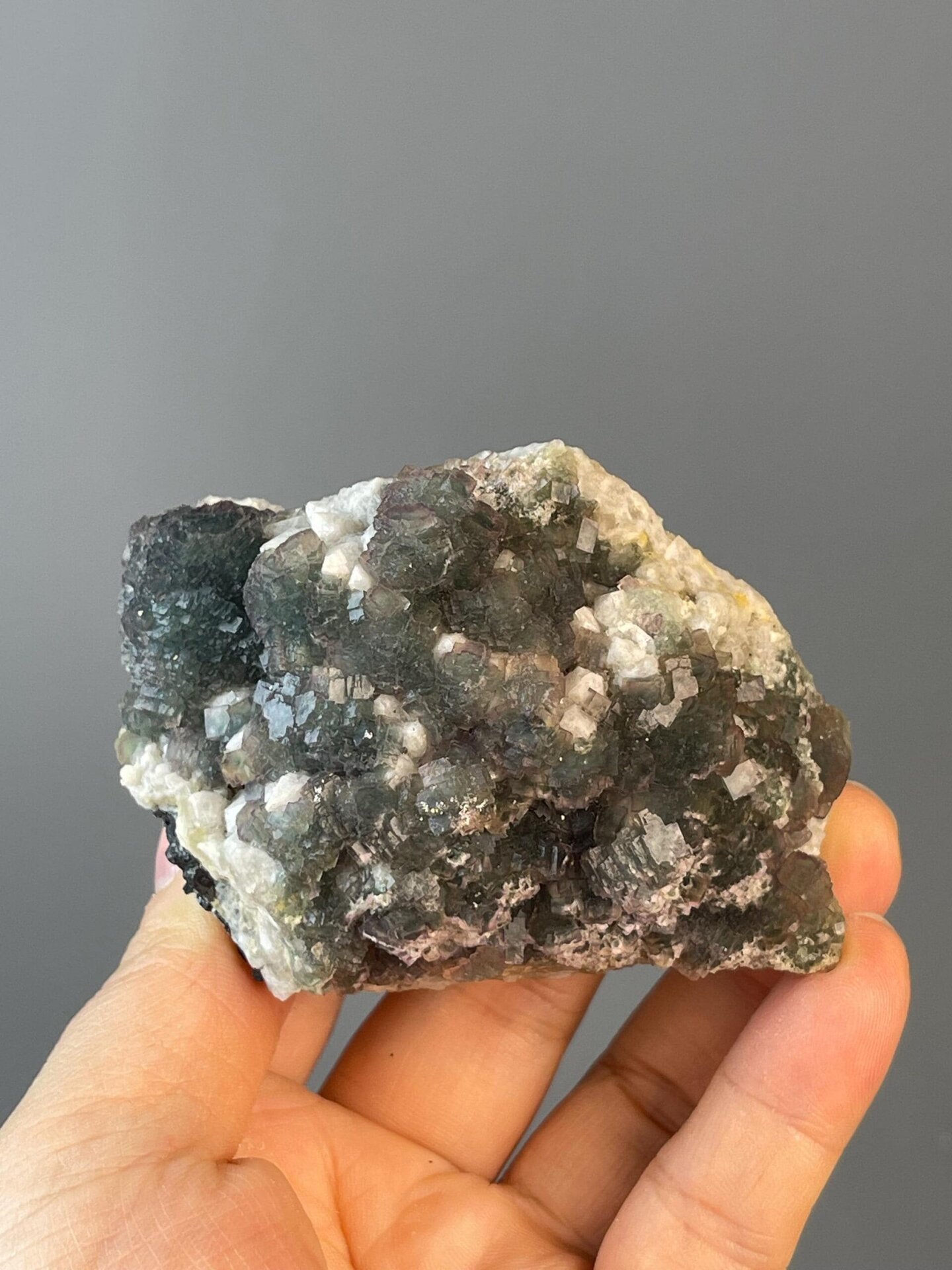 Isometric fluorite green with purple zoning, China