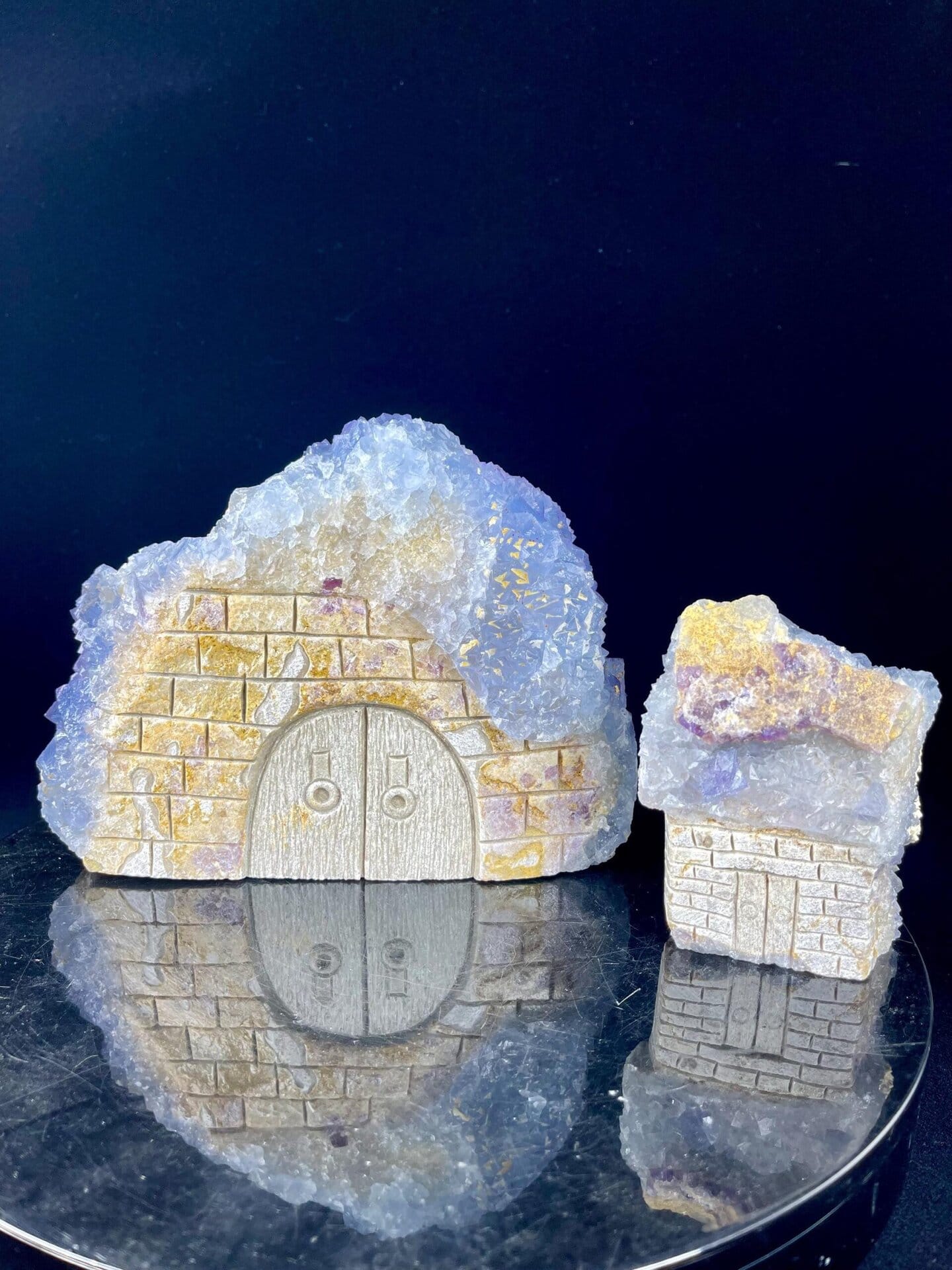 Calcite houses carved from striking blue and gold stone