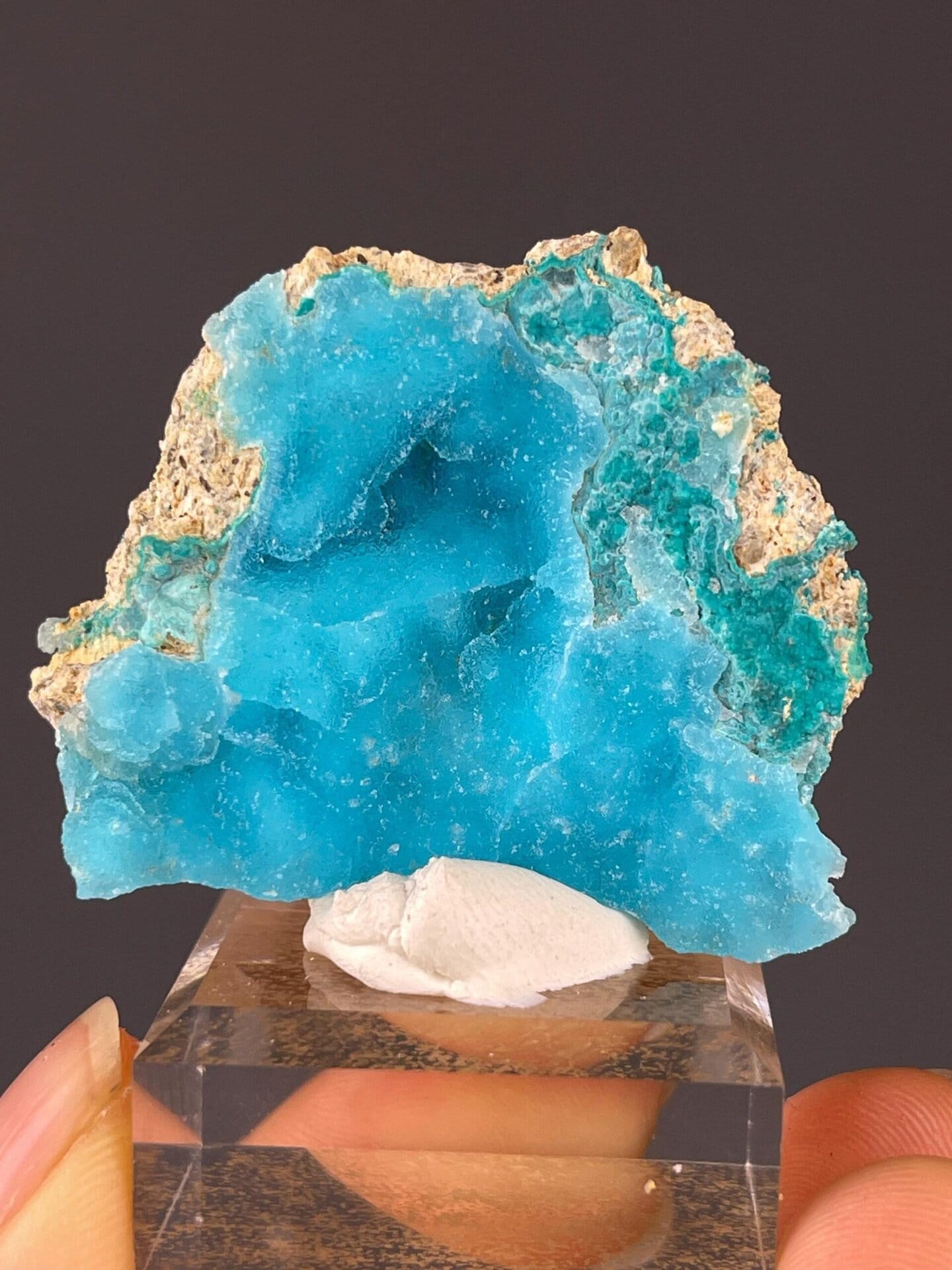 Hemimorphite Zn4Si2O7 crystal beside pink calcite, China