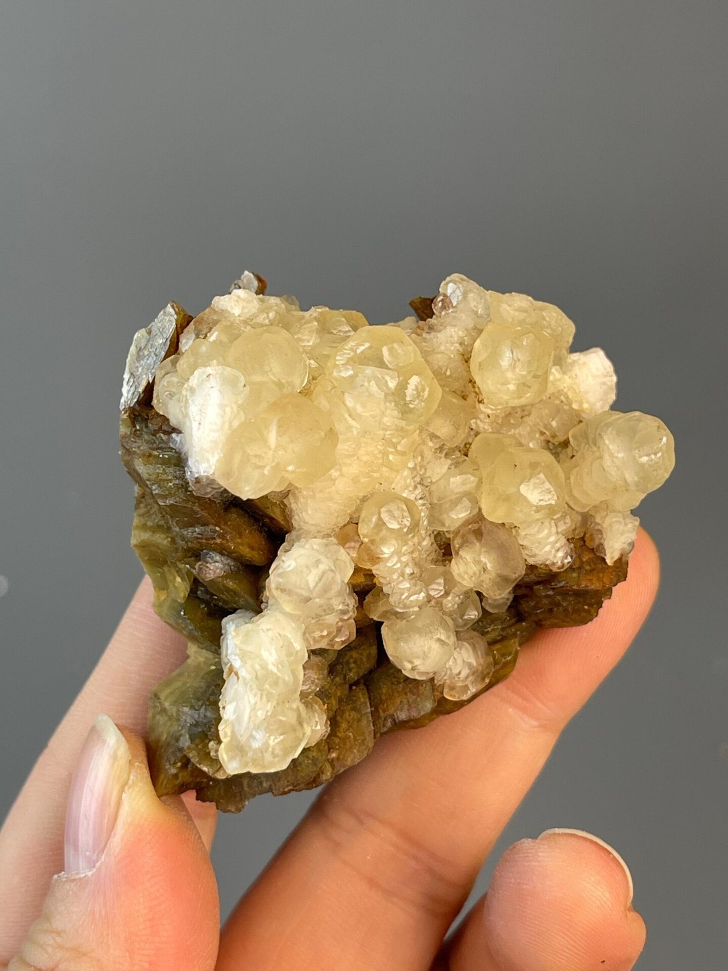 Translucent calcite CaCO3 sphere on yellow matrix, Hunan