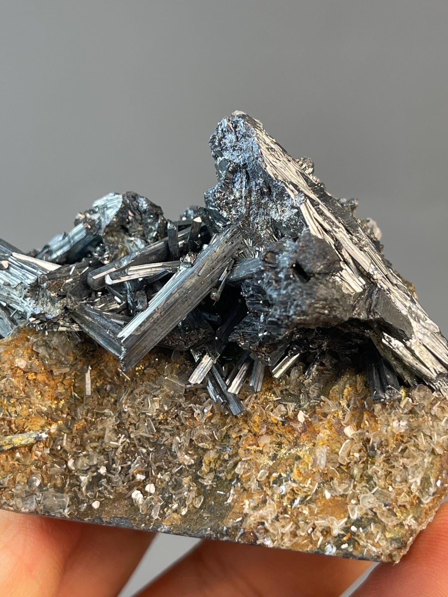 Metallic gray stibnite prismatic blades on matrix, Hunan